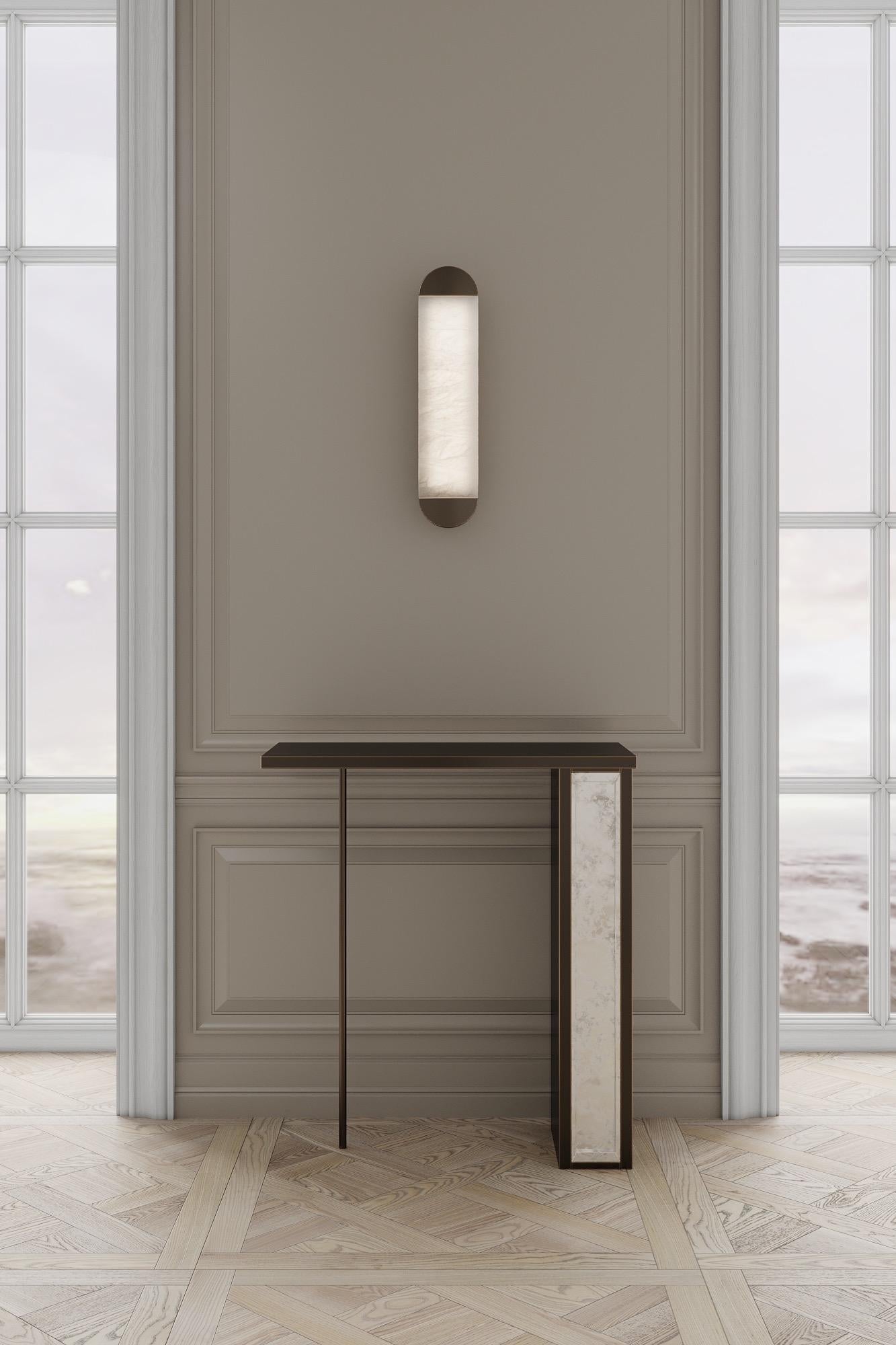 The silhouette console is designed by Emél & Browne in the Minimalist and contemporary style and custom made in Italy by skilled artisans. The delicate vertical elements of the silhouette console table resemble slender figures on the horizon against