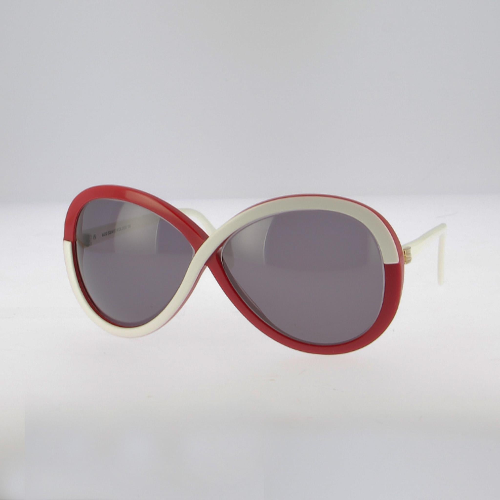Estas gafas de sol bicolor de gran tamaño, una montura Silhouette de los años 80, ofrecen un encanto vintage espectacular: el frontal de cinta bicolor : rojo intenso en el exterior, marfil en el interior, se cruza en el puente como un signo de