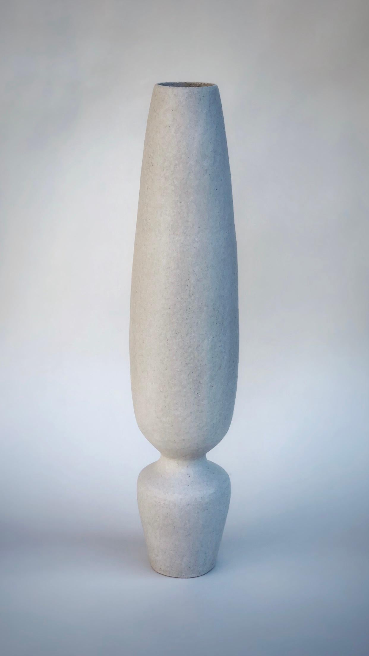 Silhouette Vase by Sophie Vaidie
One Of A Kind.
Dimensions: Ø 11 x H 58 cm. 
Materials: Beige stoneware with white mat glaze.

In the beginning, there was a need to make, with the hands, the touch, the senses. Then came the desire to create and