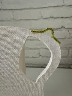 Silhouette vase with caterpillar
