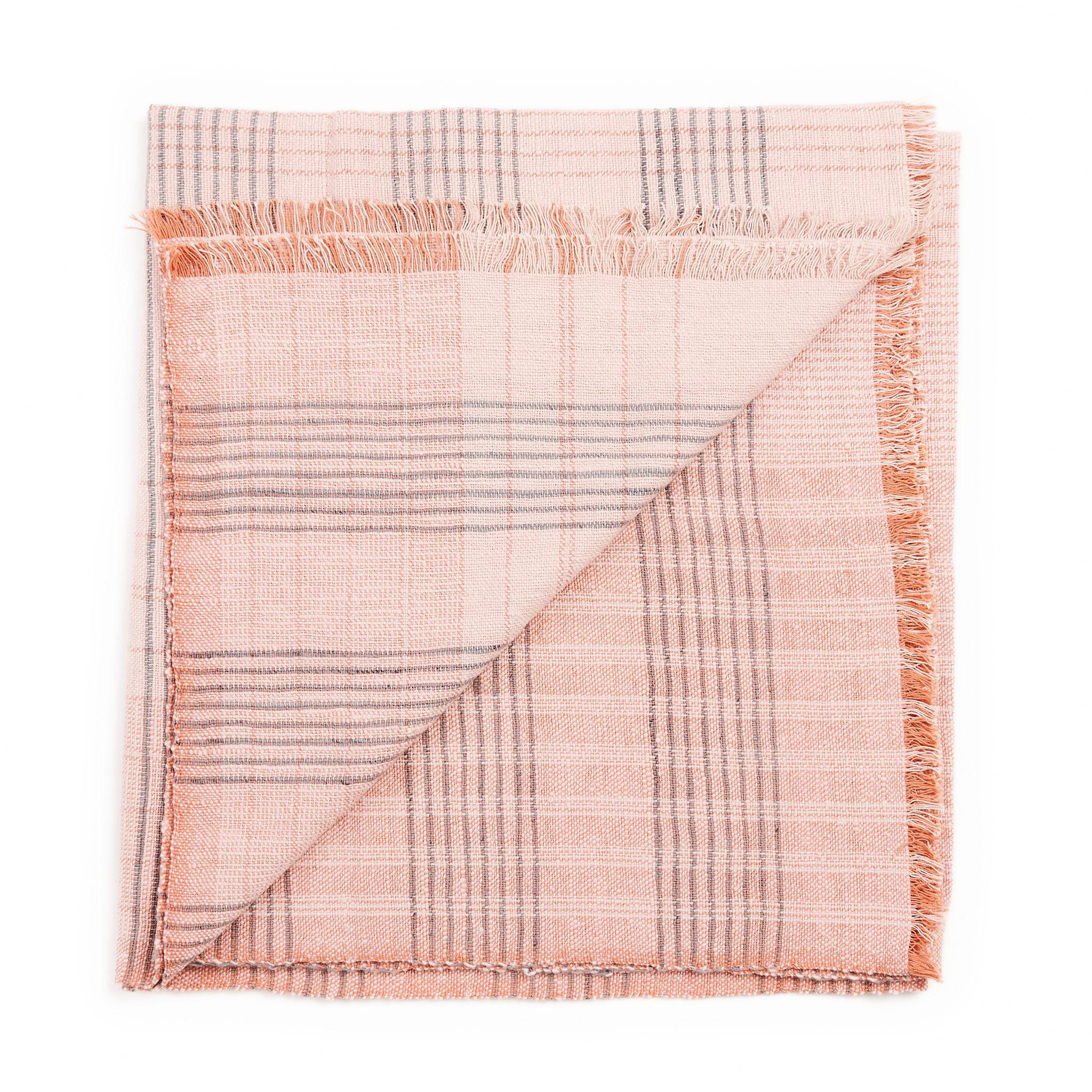 Silica Rose Throw is a modern take on combining stripes  & checks pattern in a serene color palette of dusty rose salmon and grays. Fine detail of hand weaving is done meticulously on a handwoven textile. Each piece is 100% handmade making it a