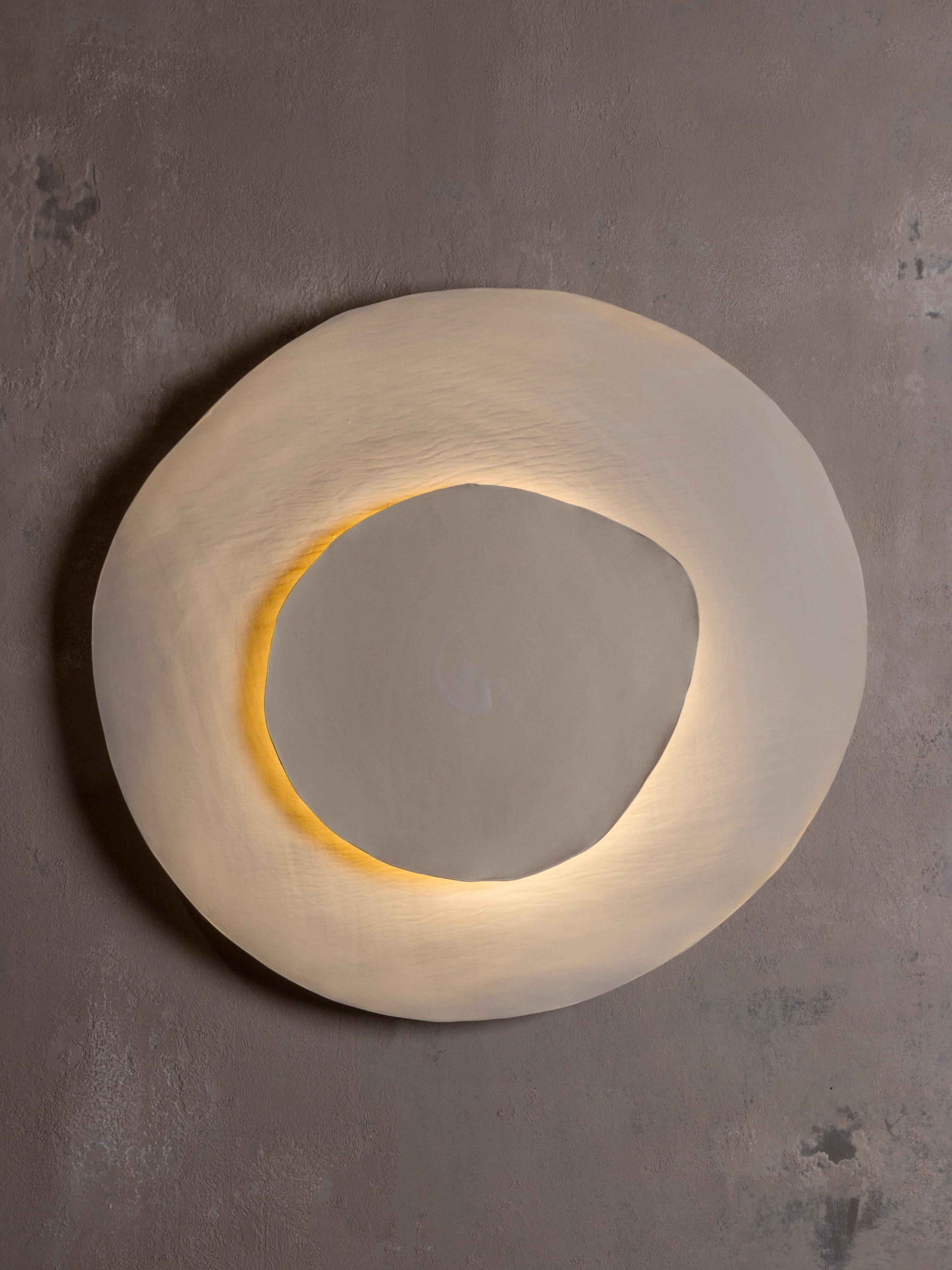 Silk #19 wall light by Margaux Leycuras
One of a Kind. Signed and numbered.
Dimensions: Ø 54 x H 58 cm
Material: Ceramic, sandy stoneware platters with a porcelain slip finish.
The piece is signed, numbered and delivered with a certificate of
