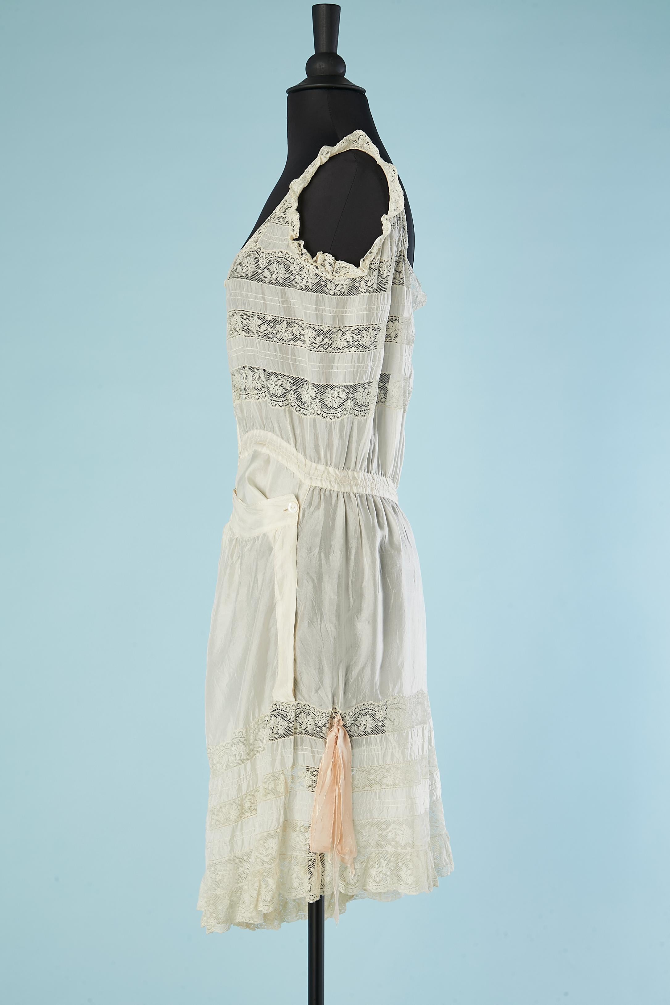 Silk and lace lingerie romper with buttons in the middle front Circa 1900's  1