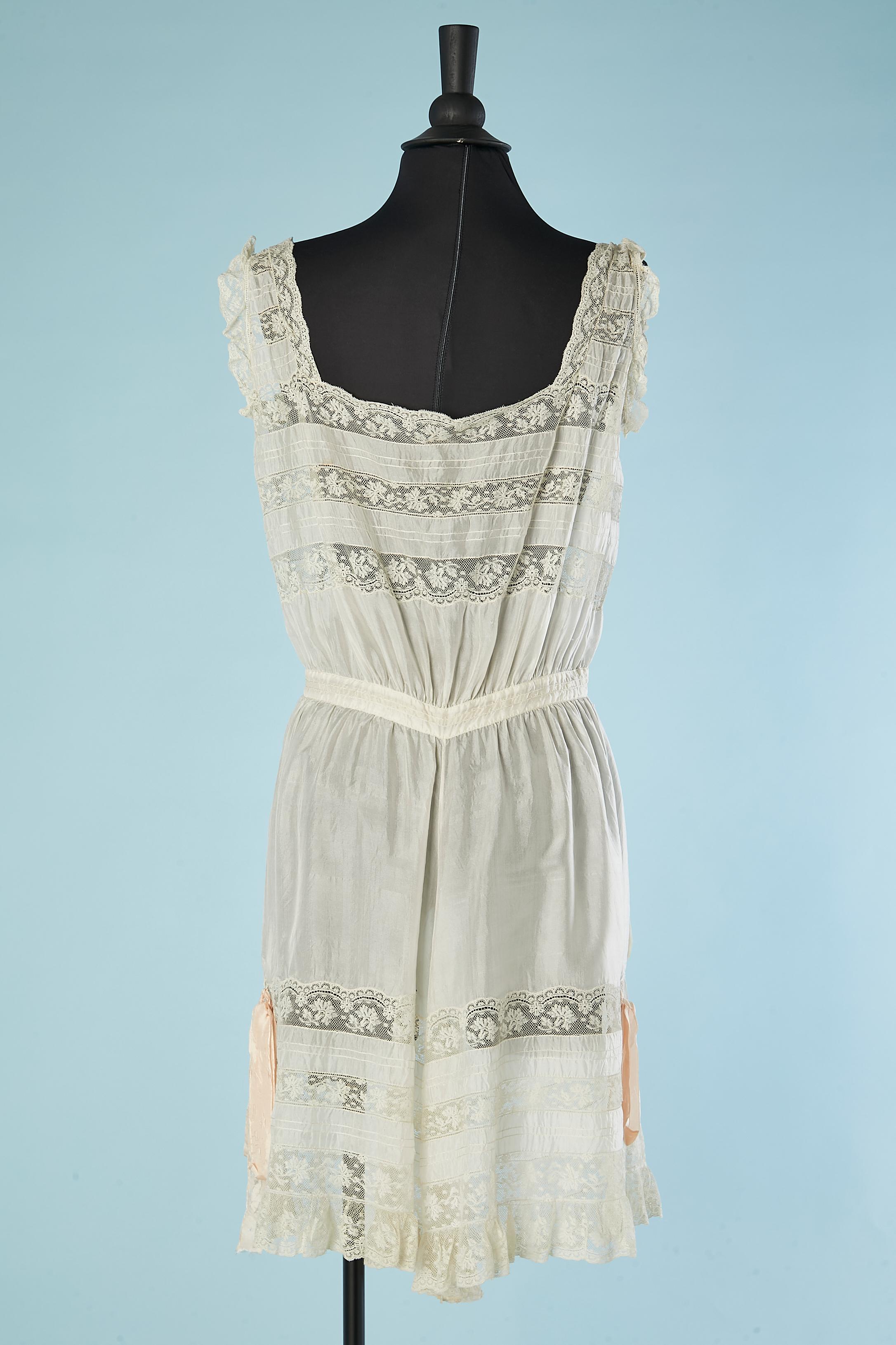 Silk and lace lingerie romper with buttons in the middle front Circa 1900's  2