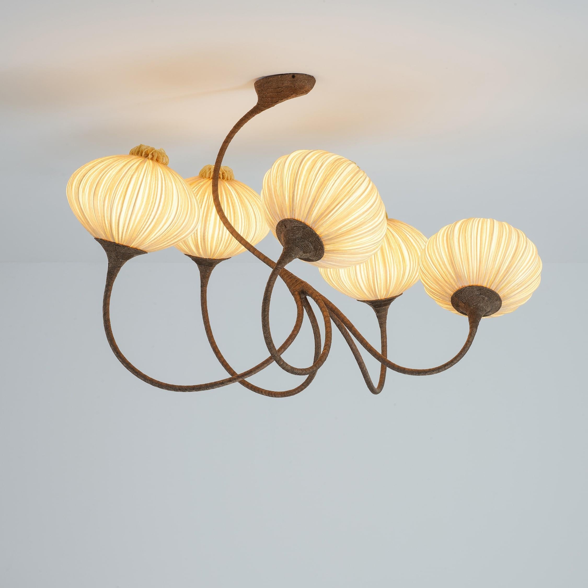 The 5 Palms chandelier is part of the Palm Family which takes its inspiration directly from nature while playing with movement and grace. The ceiling fixture is highly customizable, so it can fit any space. Its highly-stylized curvilinear branches
