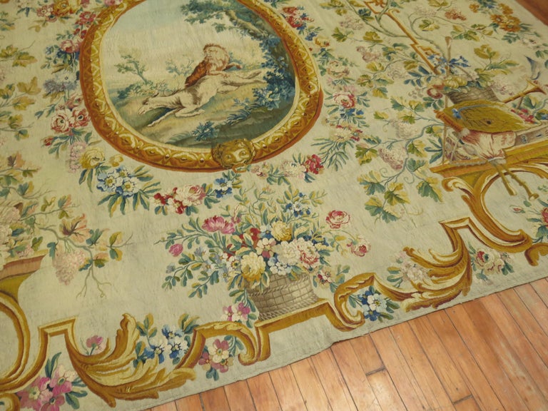 Late 18th century Aubusson tapestry panel made in France. Measures: Height 8'6'', width 10'6''

Animals in a central oval cameo amongst garlands, birds, scrolling acanthus leaves and fruit-filled baskets on an ivory field. The colors are livelier