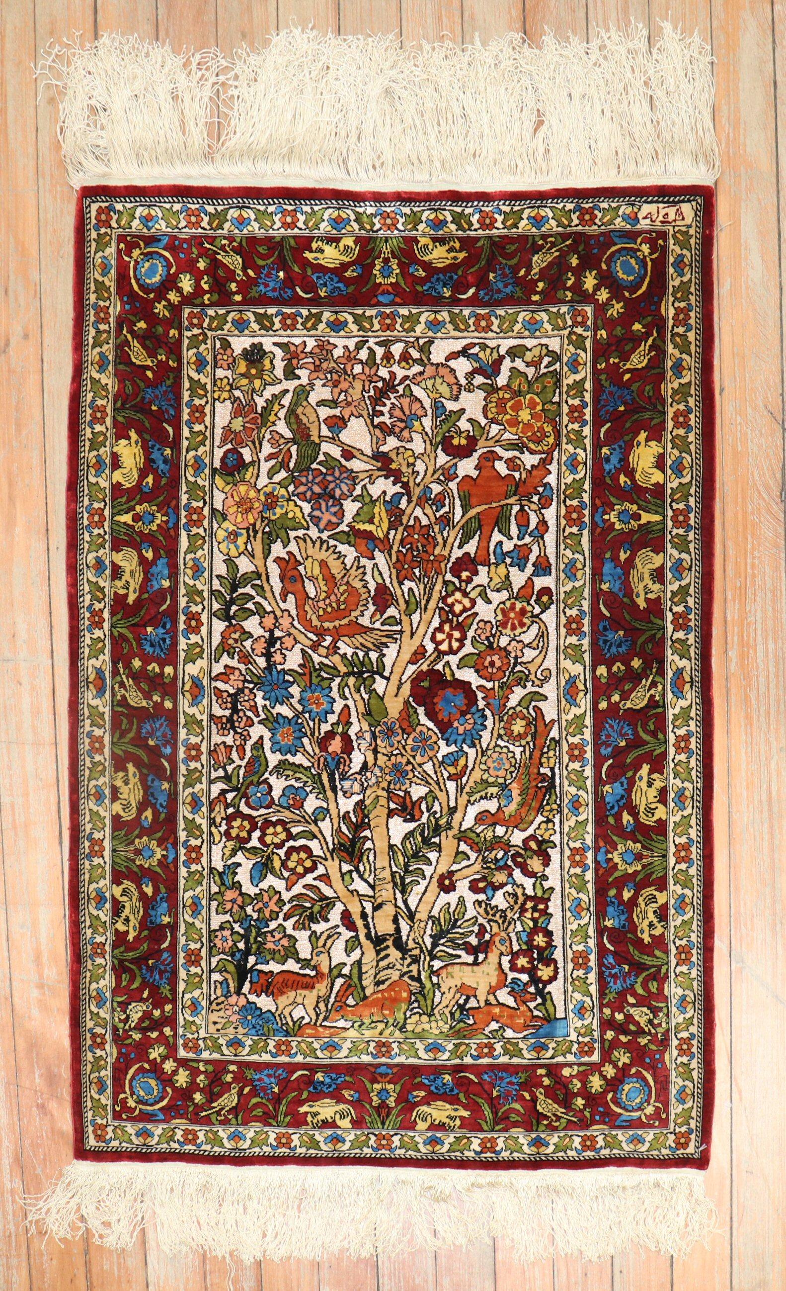 Fine Turkish silk one of a kind Herekeh rug with a beutiful pictorial animal design on an ivory field.

Measures: 2' x 2'11'.