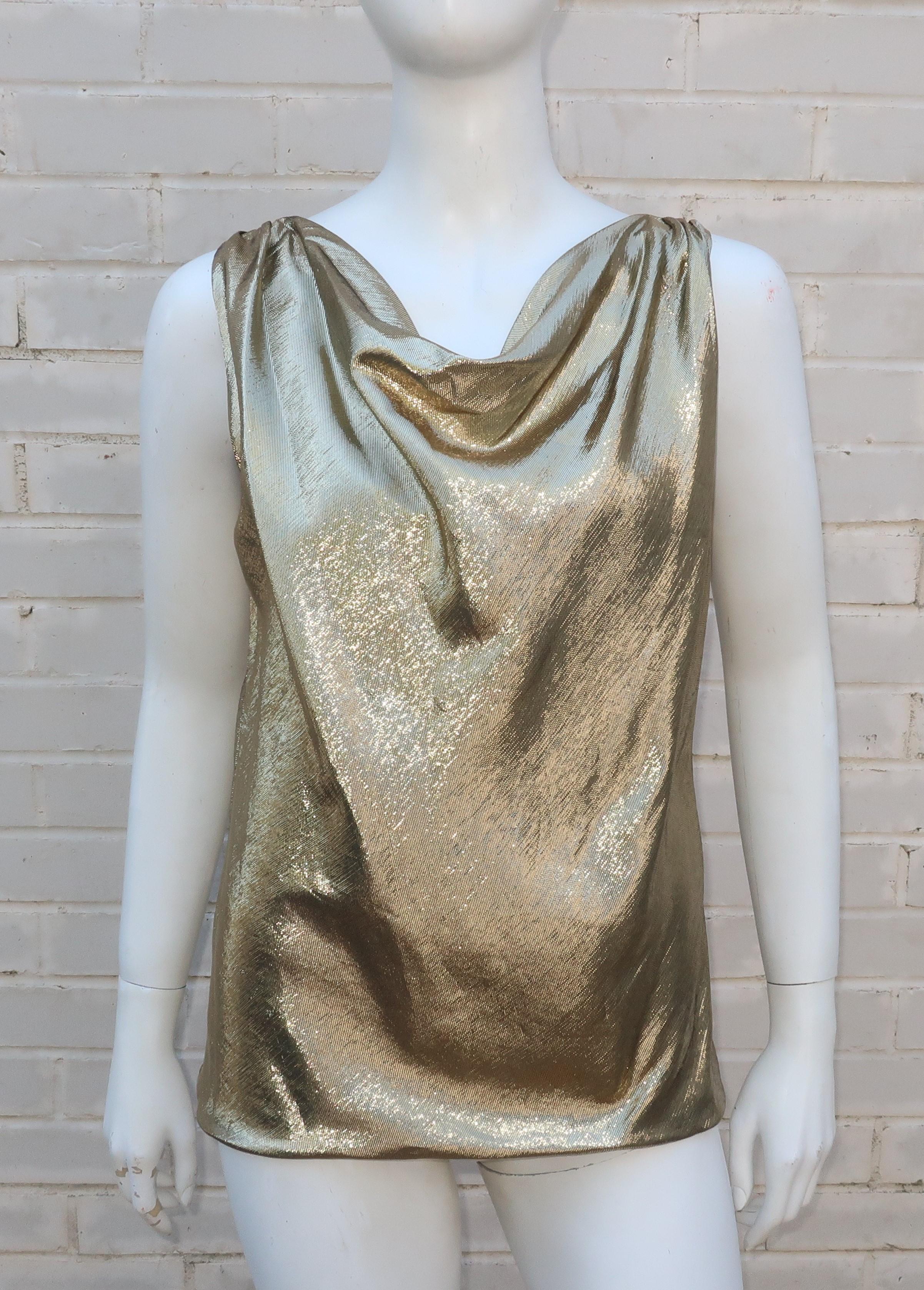 A period perfect 1970’s draped silk blend gold lamé top that has stand alone style or serves well as a shell for pairing with jackets.  Pull over construction with a singular amber rhinestone button at the back and well made with lining and a fabric