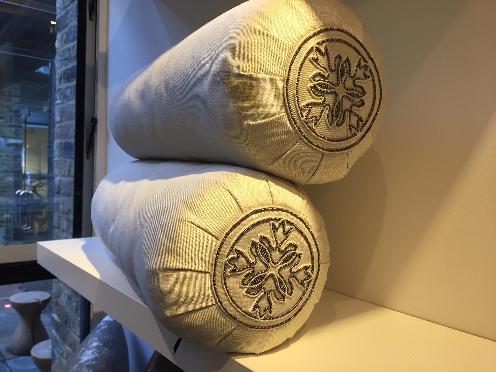 Silk Bolster cushions : Fabric hand woven silk col. Oyster with hand embroidery in grey silk yarn and silver beading on both ends of each bolster size about 62cm x 20cm,
Cushion cover lined with cotton lining and concealed zip, including bolster