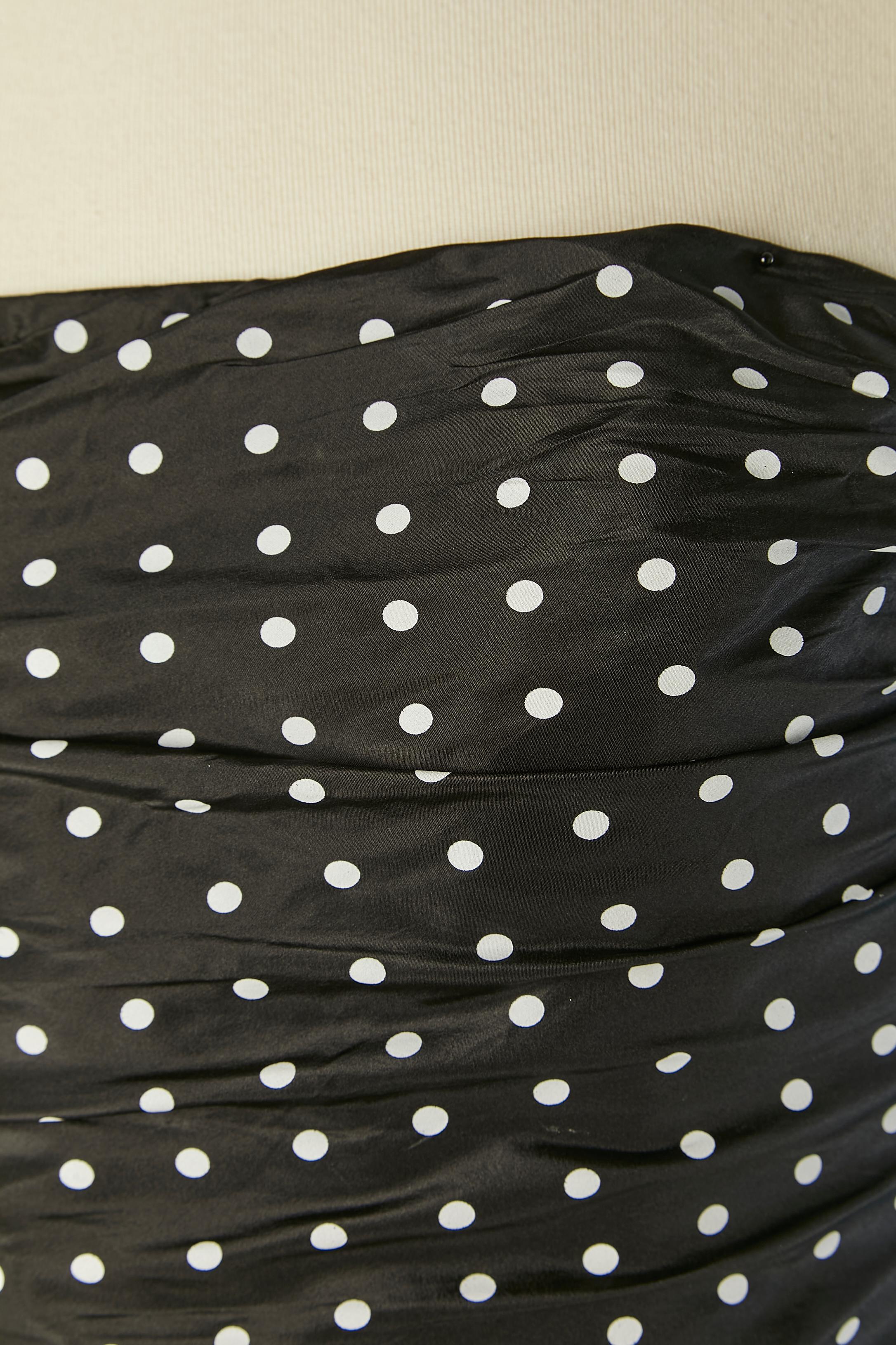 Silk bustier cocktail dress with Polka dots pattern and ruffles. Draped on the bust. Boned bustier inside the bust with hook&eye closure on the left side. Zip closure of the dress on the top. Plastic strap inside the bustier on the top edge . 
SIZE