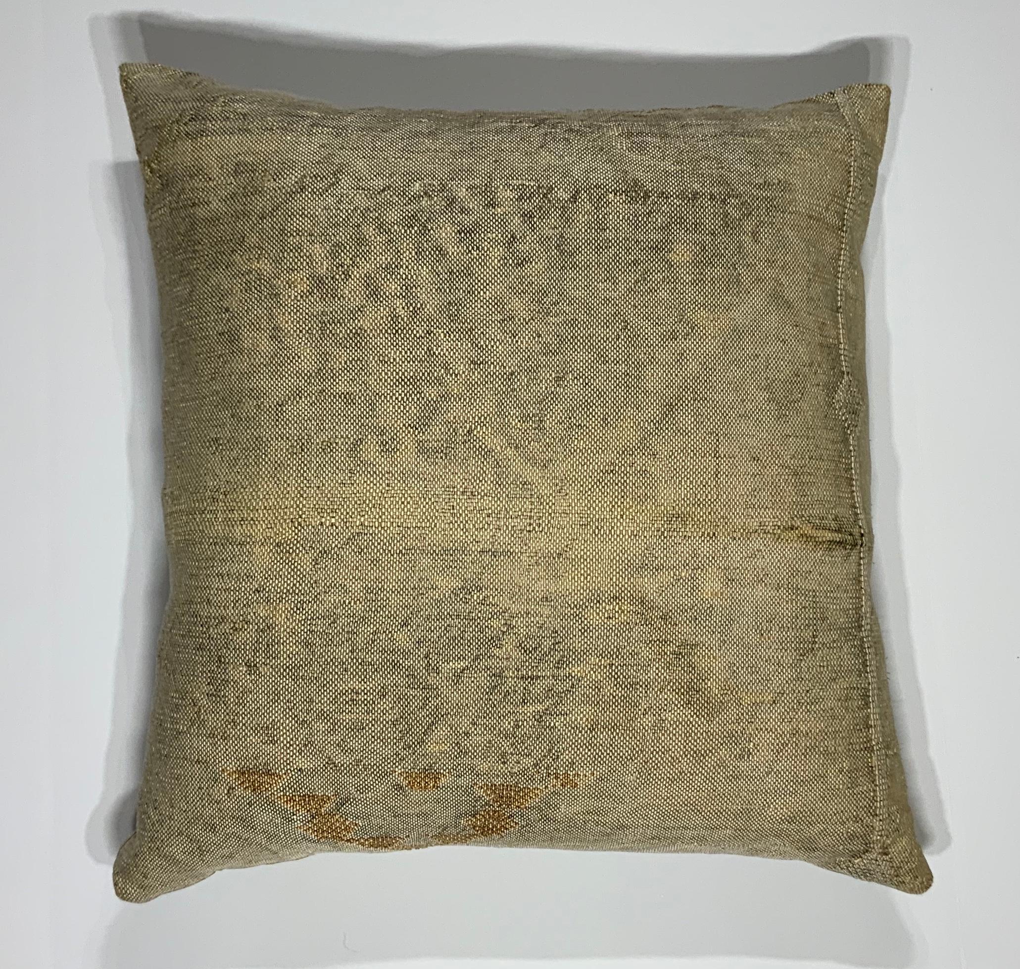 Beautiful pillow made of handwoven flat-weave rug fragment, cream camel color with geometric motif, silk backing, fresh down and feather insert.