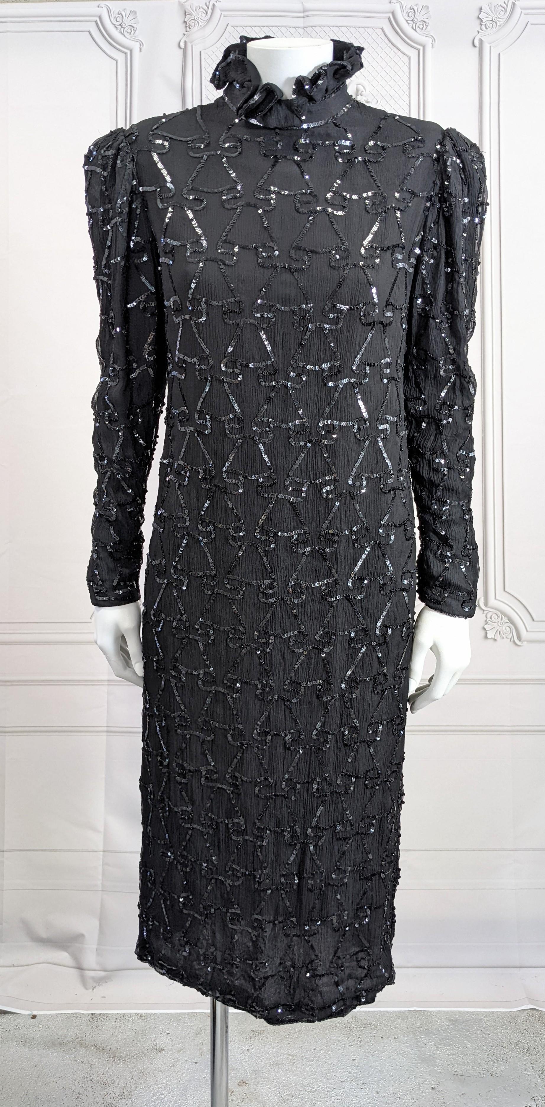 Elegant Silk Chiffon Sequin Ruffle Dress made for Saks Fifth Ave. Simple sheath shape with puffy sleeves and tight ruffled collar, all sequined with a folded ruffle pattern. 
A very timeless shape with a tight high collar. Collar is quite small.