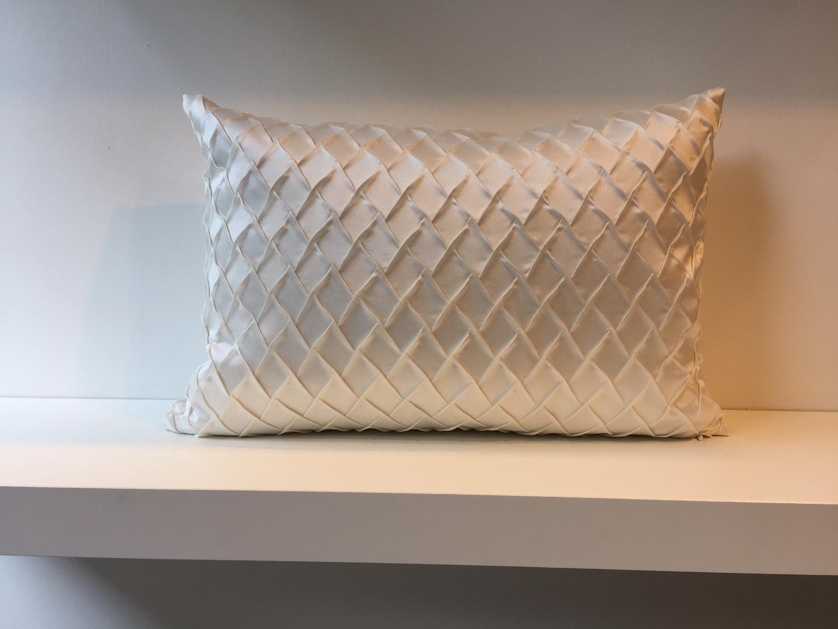 One pair silk cushions with embossed front panel in steam pleated silk, fish scale pattern, back panel plain silk, handwoven silk taffeta col. Oyster, size 35 x 50cm,
cushion cover with concealed zipper in the bottom seam,
inner pad with new