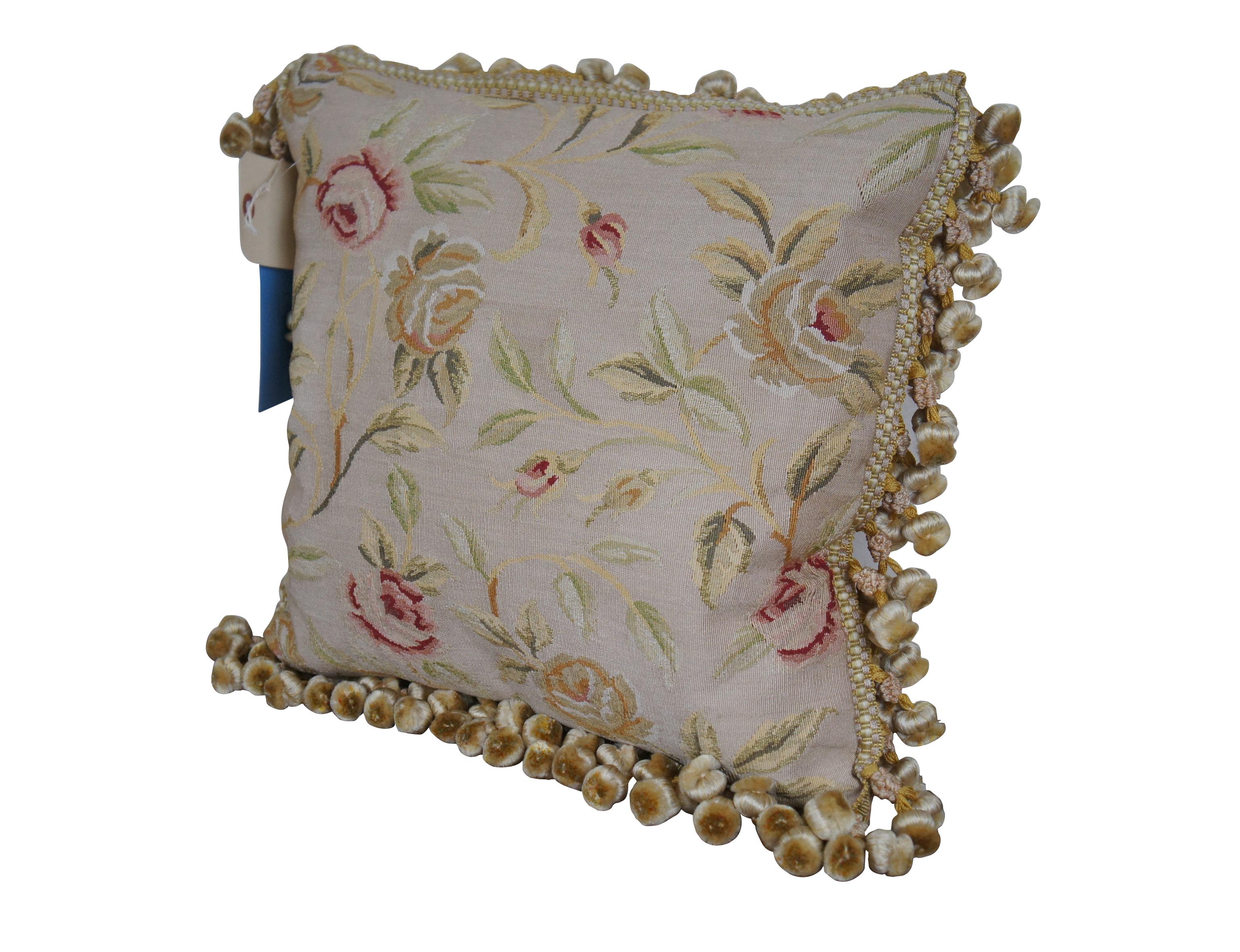 20th century square throw pillow, embroidered in silk with leafy stems of large yellow and pink roses. Cream and gold ball tassel trim. Light brown velour back with zipper closure.

Dimensions:
16