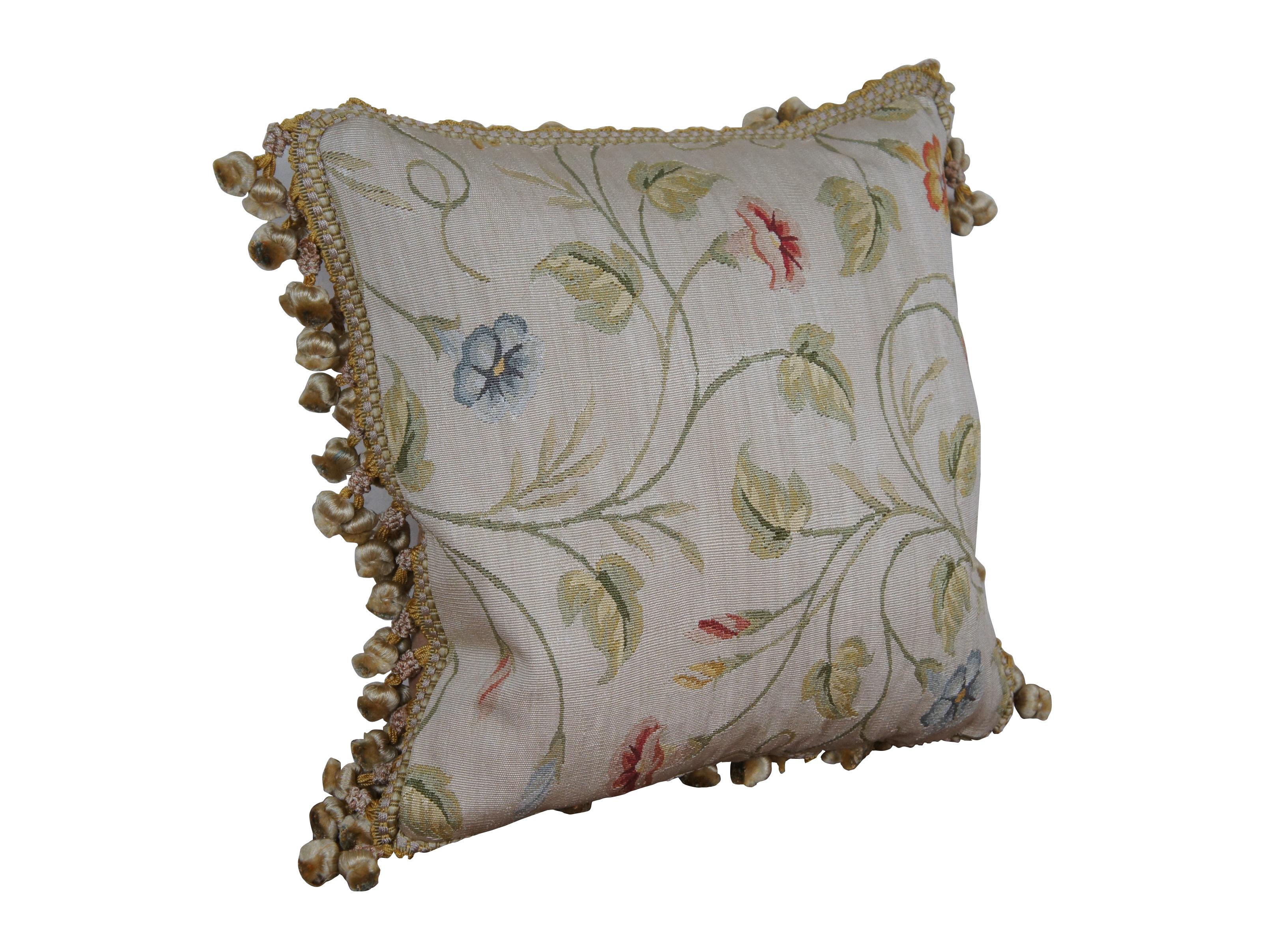 3 Available - 20th century square throw pillow, embroidered in silk with twisting green leafy stems sporting pink, blue, and orange morning glories. Cream and gold ball tassel trim. Beige velour back with zipper closure. Down filled.