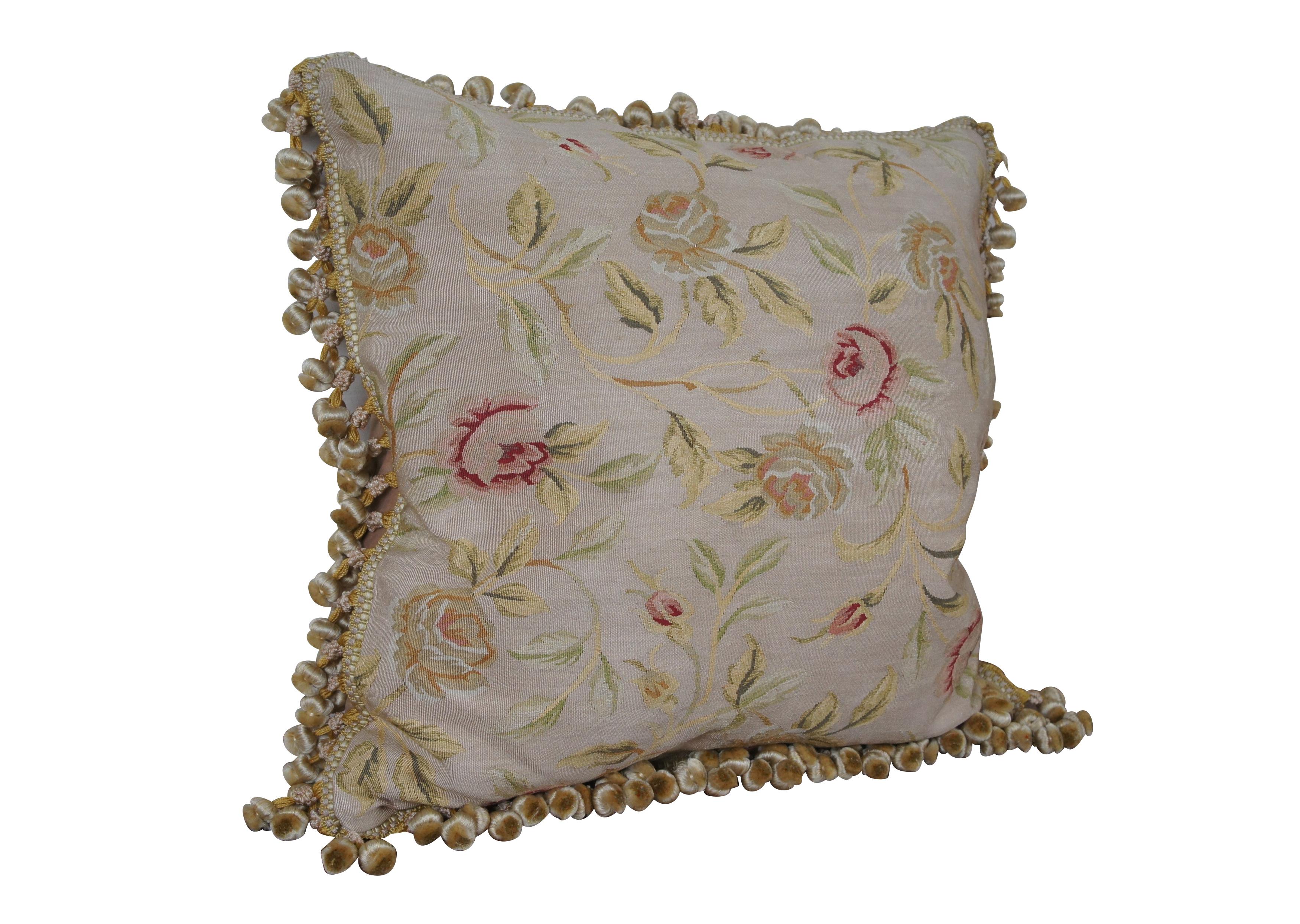 20th century square throw pillow, embroidered in silk with leafy stems of large yellow and pink roses. Cream and gold ball tassel trim. Light brown velour back with zipper closure. Down filled.

Dimensions:
22