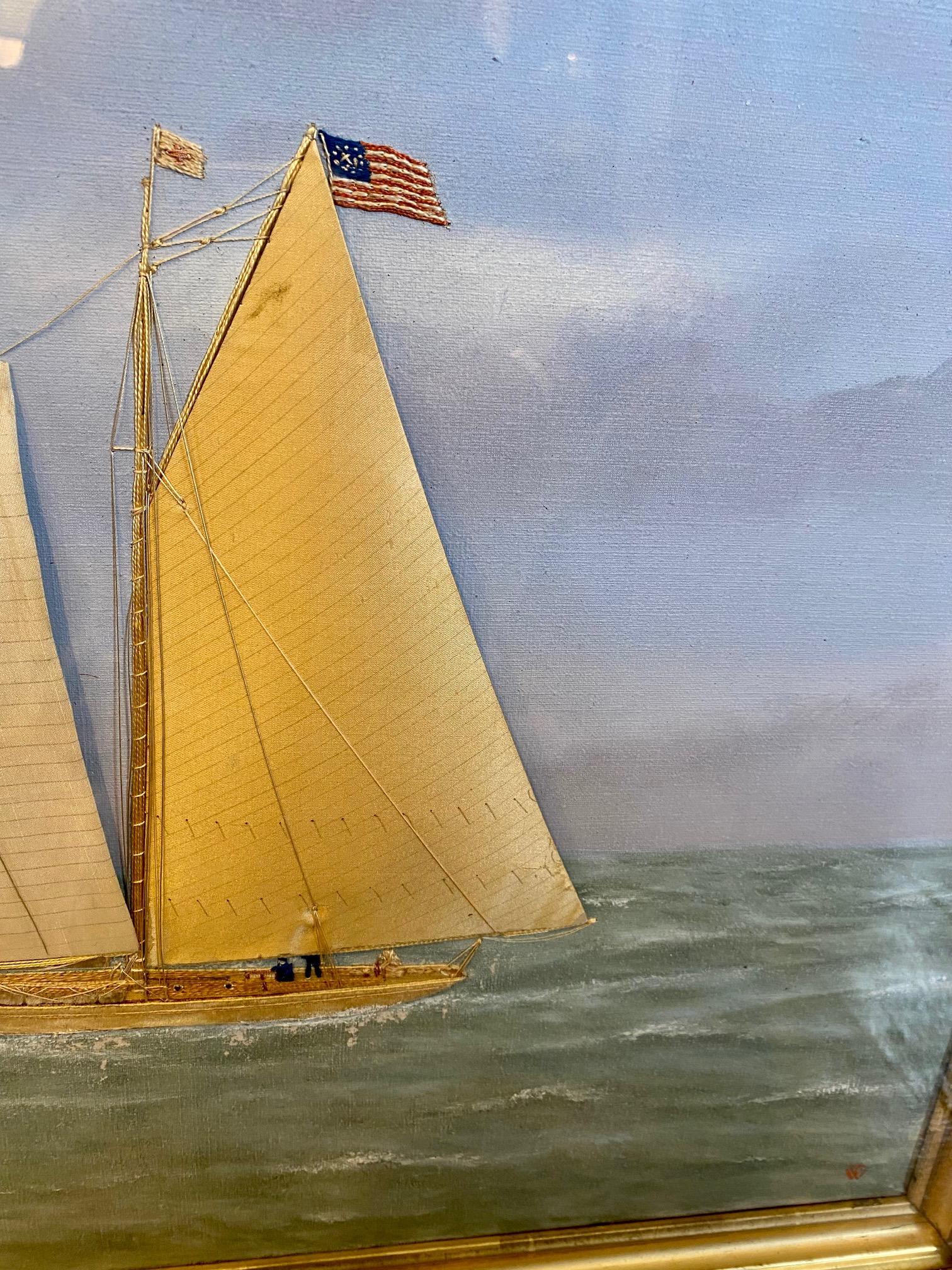 19th century silk embroidered and hand painted oil on canvas seascape by Thomas Willis (1850 - 1925), depicting a schooner-rigged racing yacht closely hauled on a starboard tack, flying the American Ensign and Burgee of the New York Yacht Club, two