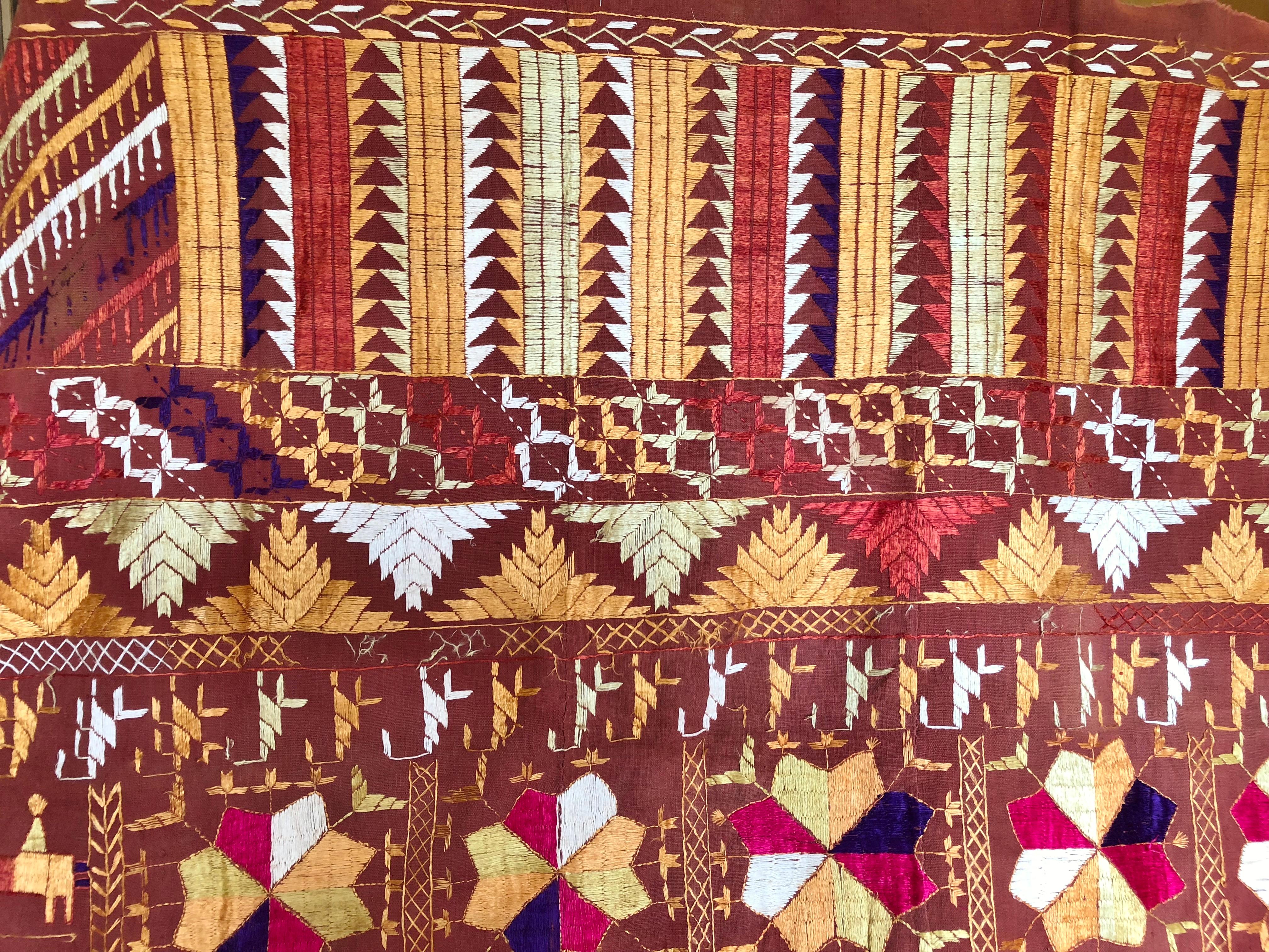 One of a kind vintage Phulkari wedding shawl from Punjab, India. The hand loomed cotton khadi cloth is embroidered with vibrant threads by relatives of the young girl for her wedding. It was made for personal use, not the tourist market. The shawl