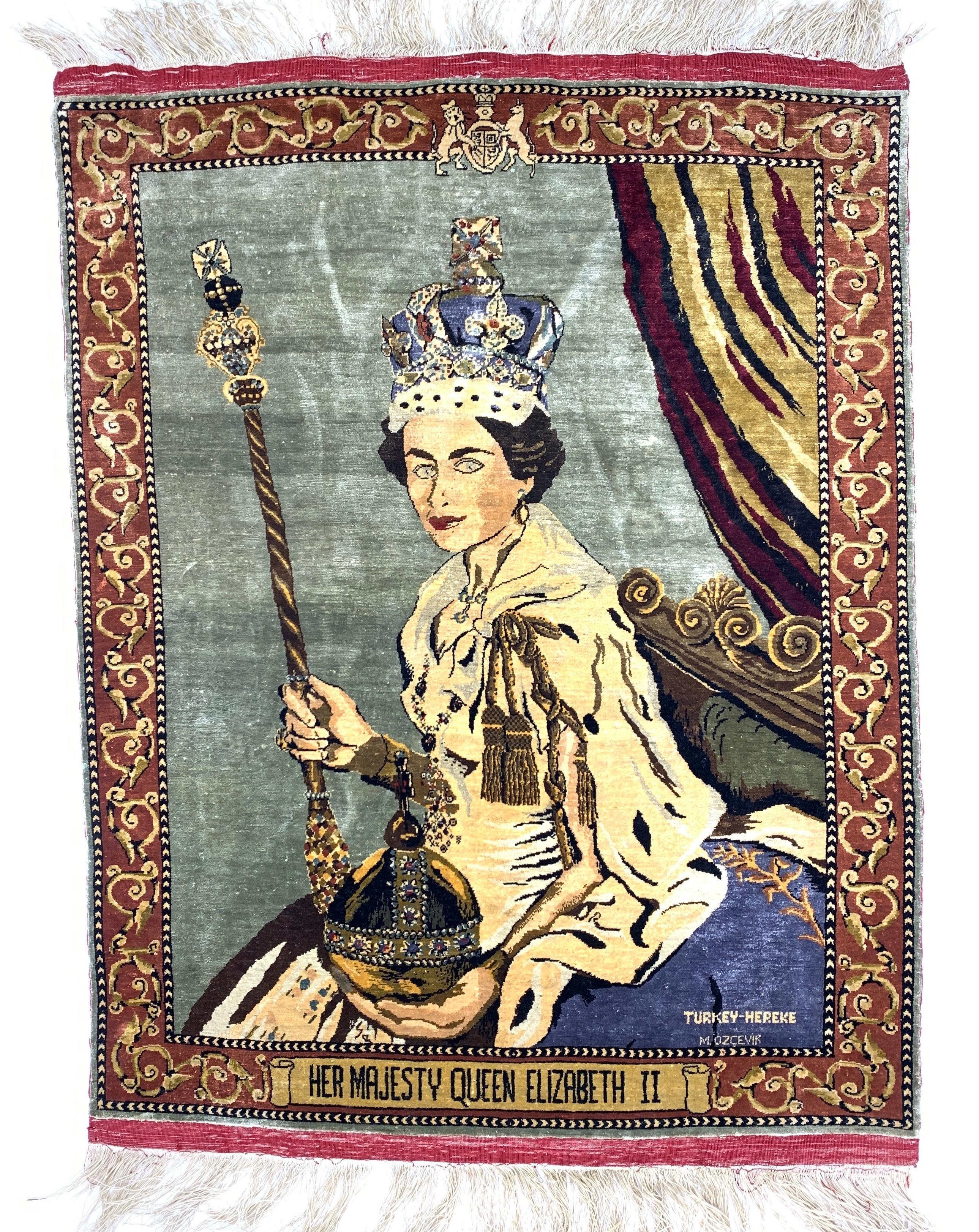 A fine signed Hereke rug depicts a portrait of her majesty queen Elizabeth II.
 