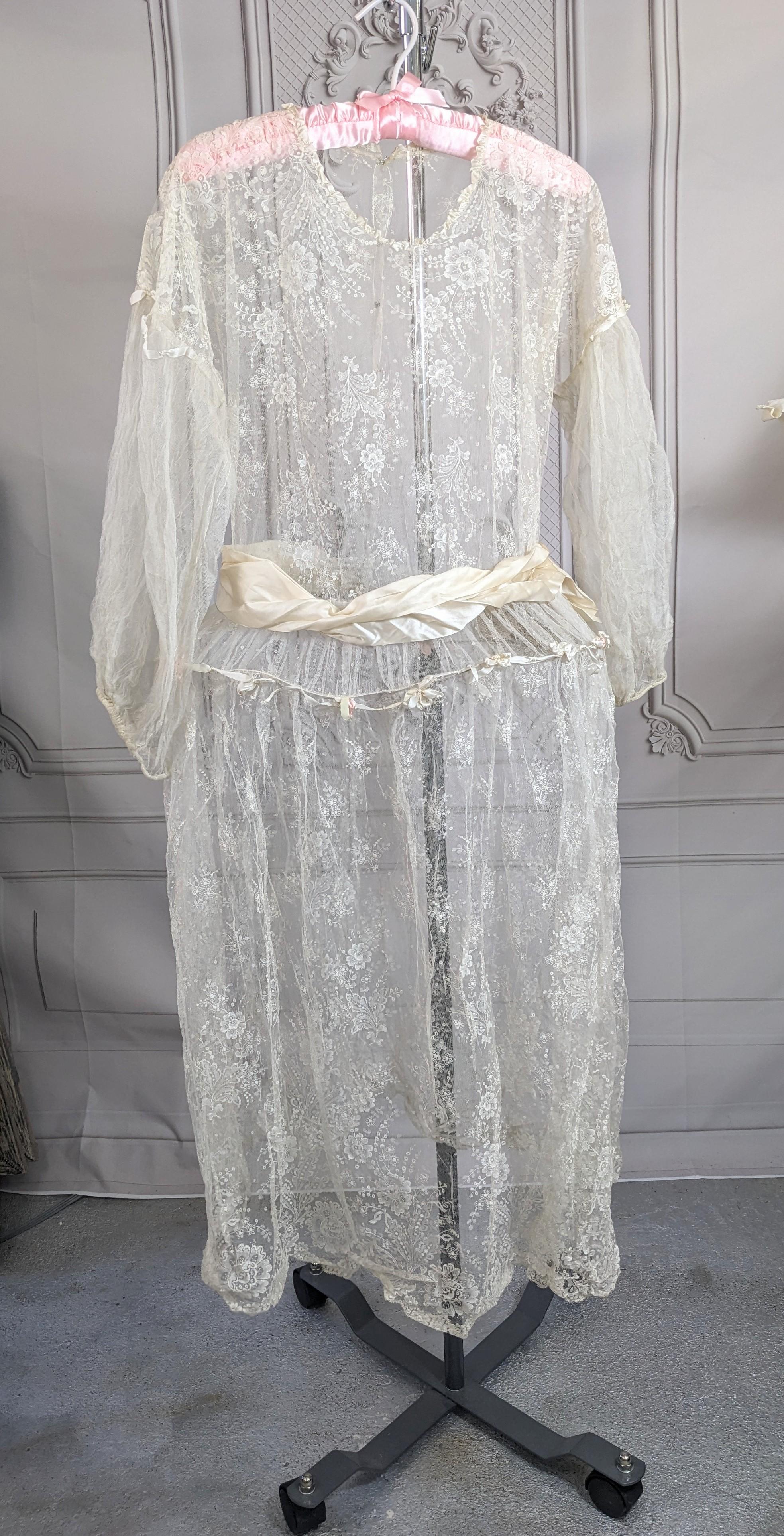 Lovely Silk Lace and Tulle Robe de Style from the 1920's. Likely designed for a young girl's party and hand made. Antique lace used on bodice and skirt with silk tulle on gathered sleeves. A wire hoop is inserted at hip with a garland of ribbon