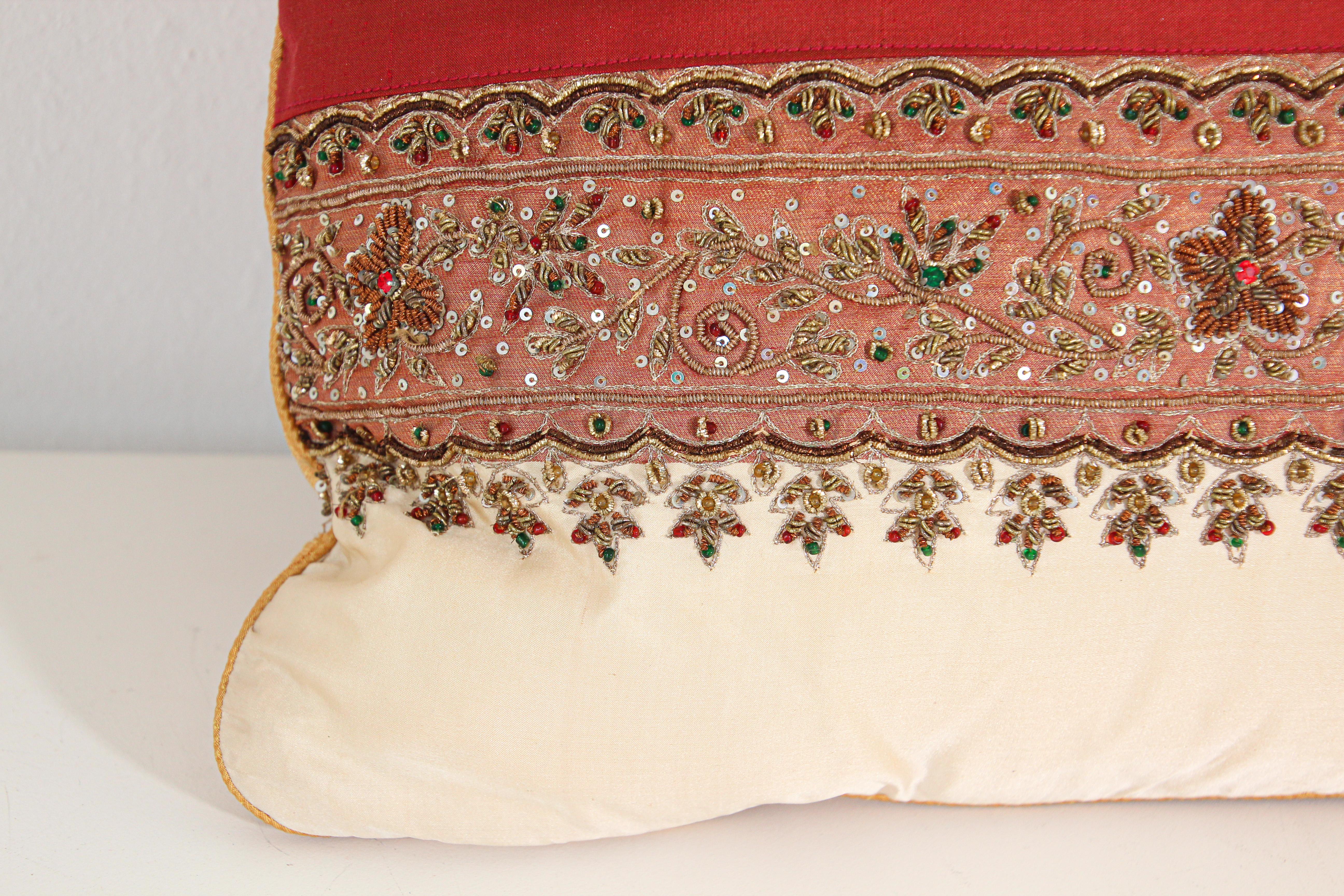 Decorative Ivory color accent lumbar pillow hand embroidered and embellished with sequins and beads.
Vanilla Dupioni silk with gold, red and green beads flower designs.
Down insert zipper in back.
Decorative twisted trims all around.
Handcrafted