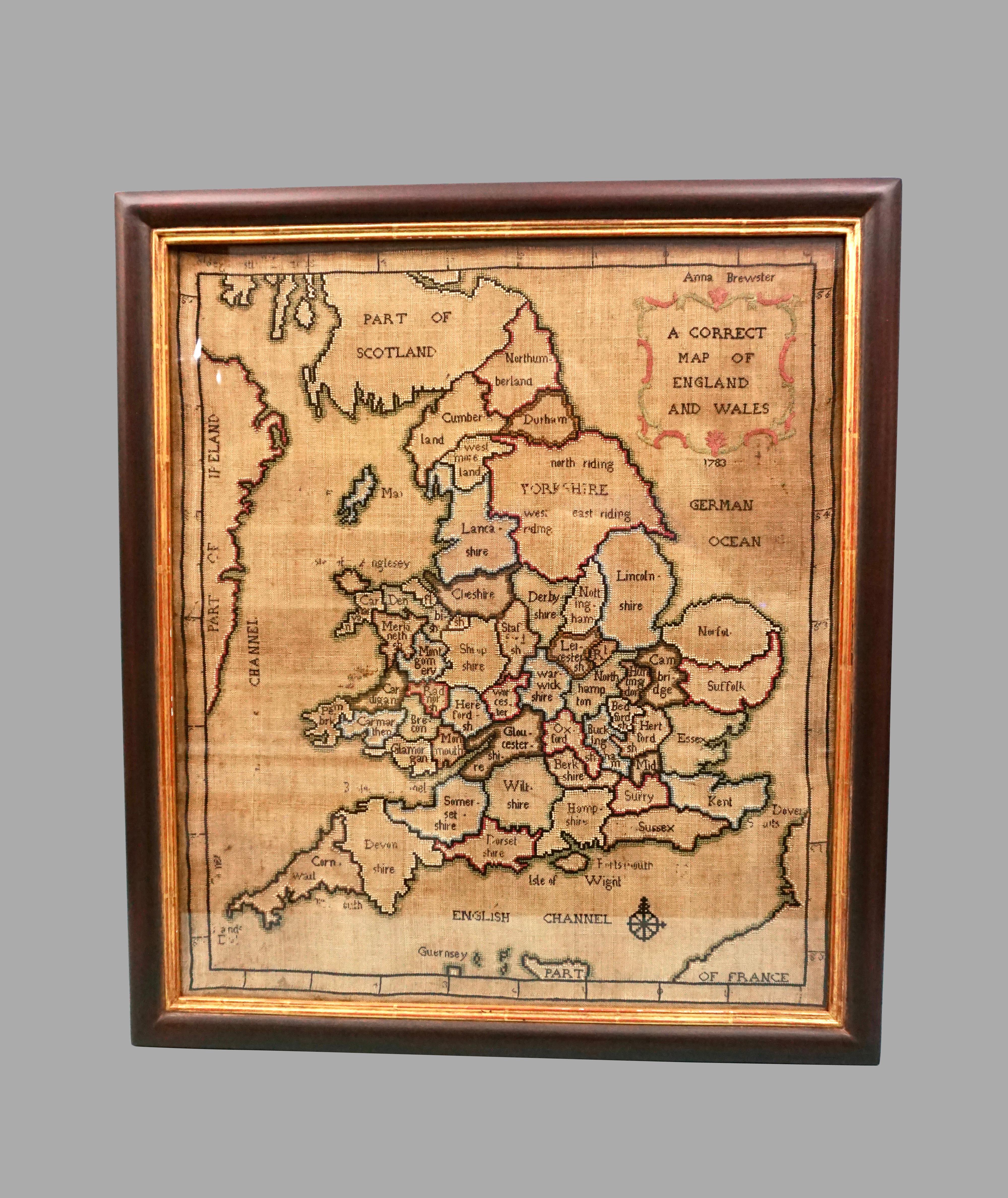 A charming silk needlework depiction of England and Wales executed in 1783 by Anna Brewster. This Georgian map sampler is signed and dated in the upper left hand corner, mounted and framed. Brewster was undoubtedly a young school girl and this sort