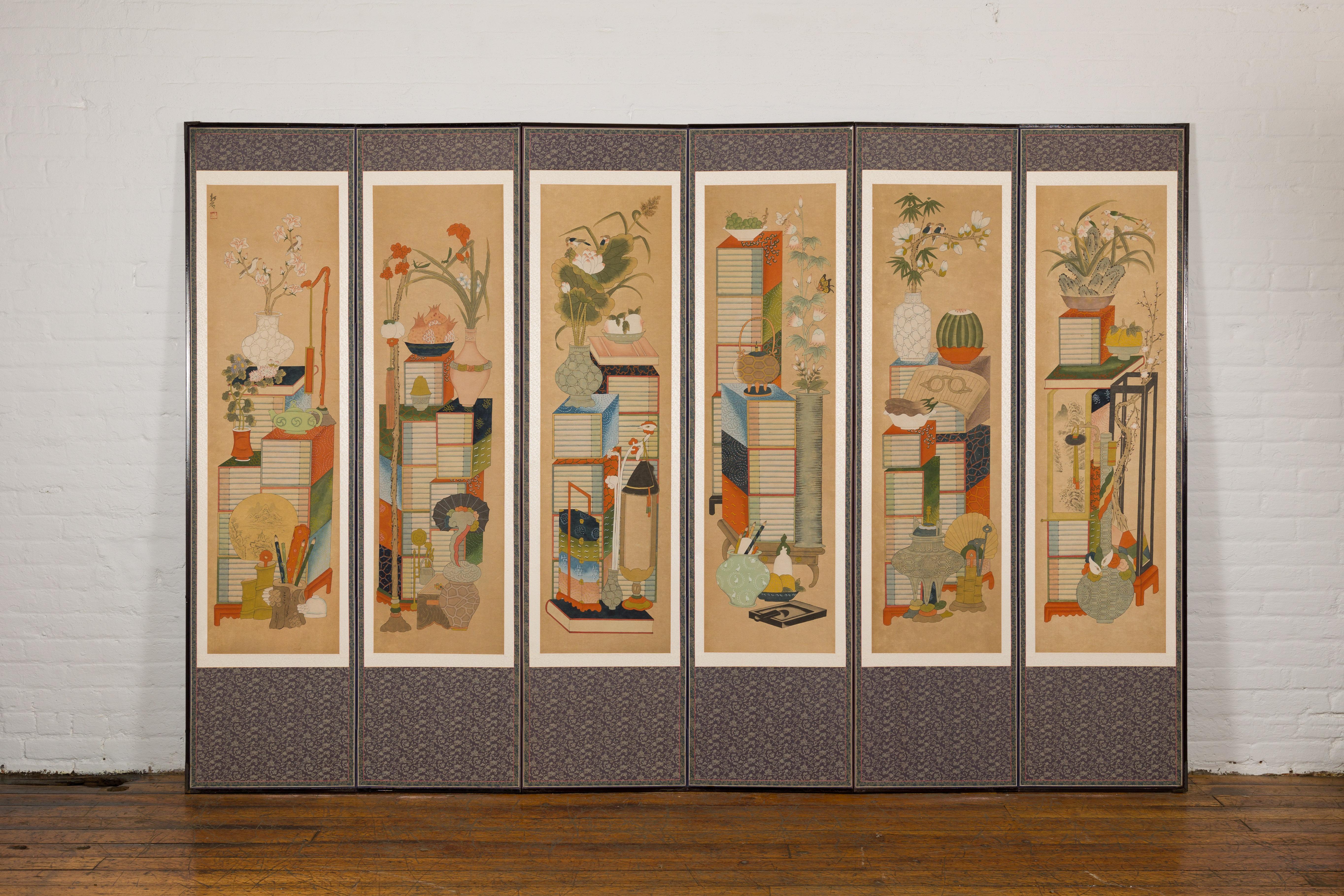 A vintage silk on paper Chinese six panel floor screen with hand-painted décor depicting traditional household items. Embark on a journey through the splendor of Eastern aesthetics with this vintage silk on paper Chinese six-panel floor screen.