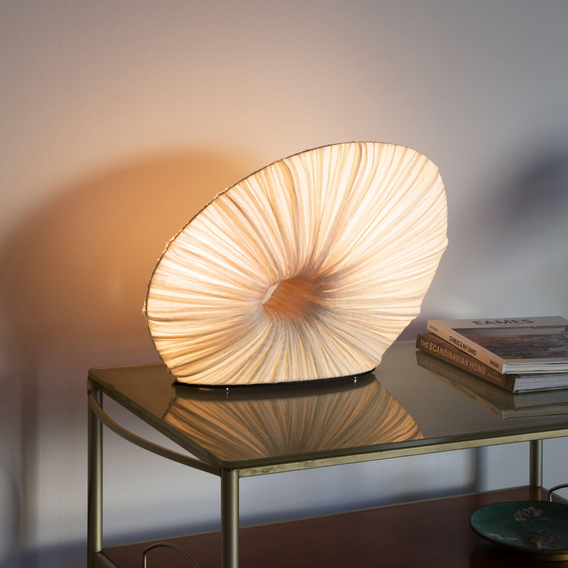 A petit plug-and-play table lamp, hand made from crushed silk and metal.