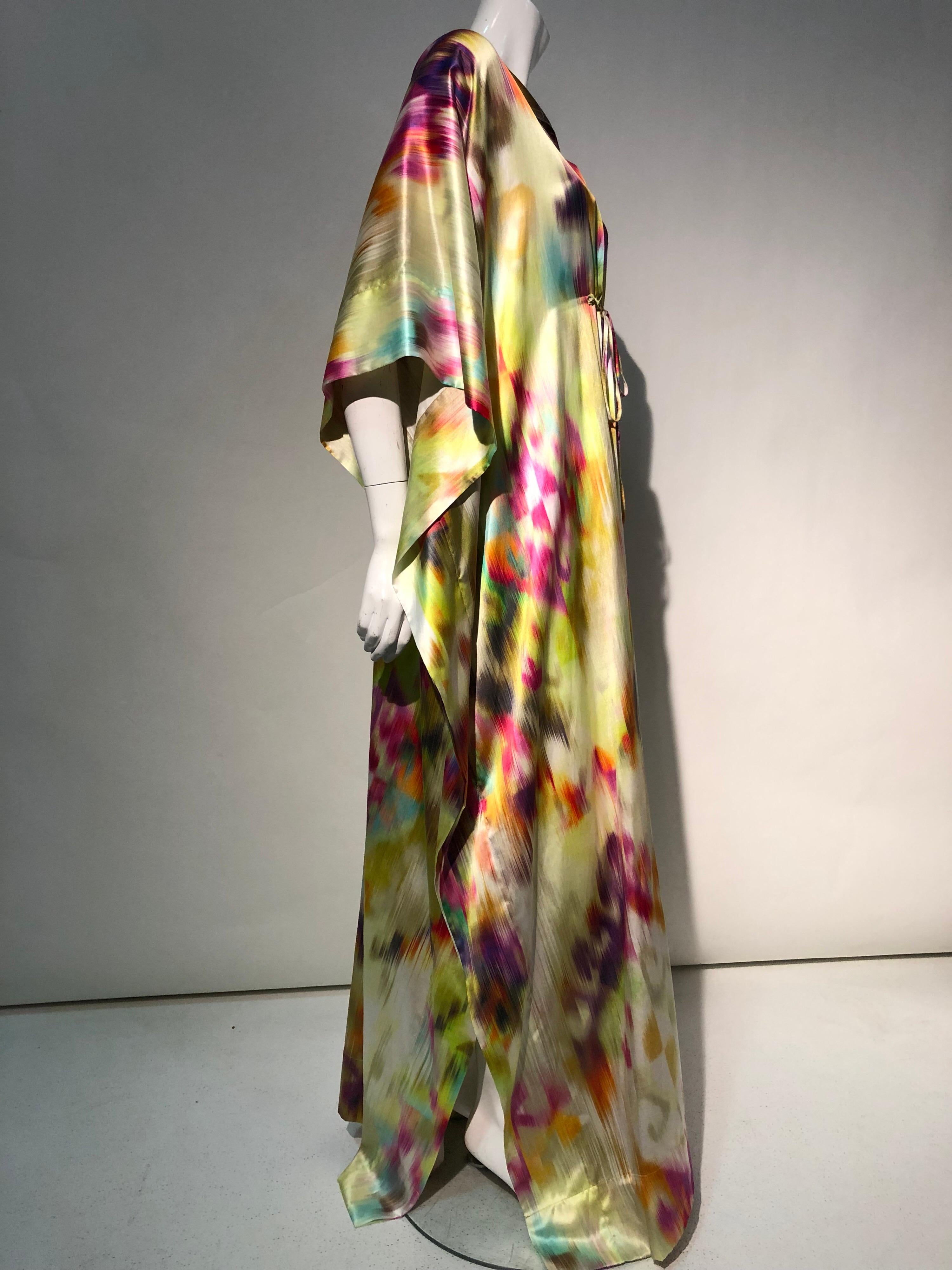 A fabulous Torso Creations silk and cotton satin Ikat-patterned caftan with small v-neck and drawstring at bust. This beautiful, rainbow color, deconstructed Ikat pattern really is striking. 