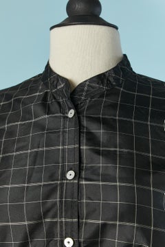 Un insieme di camicia e gonna in seta con motivo a quadri MAGGY ROUFF