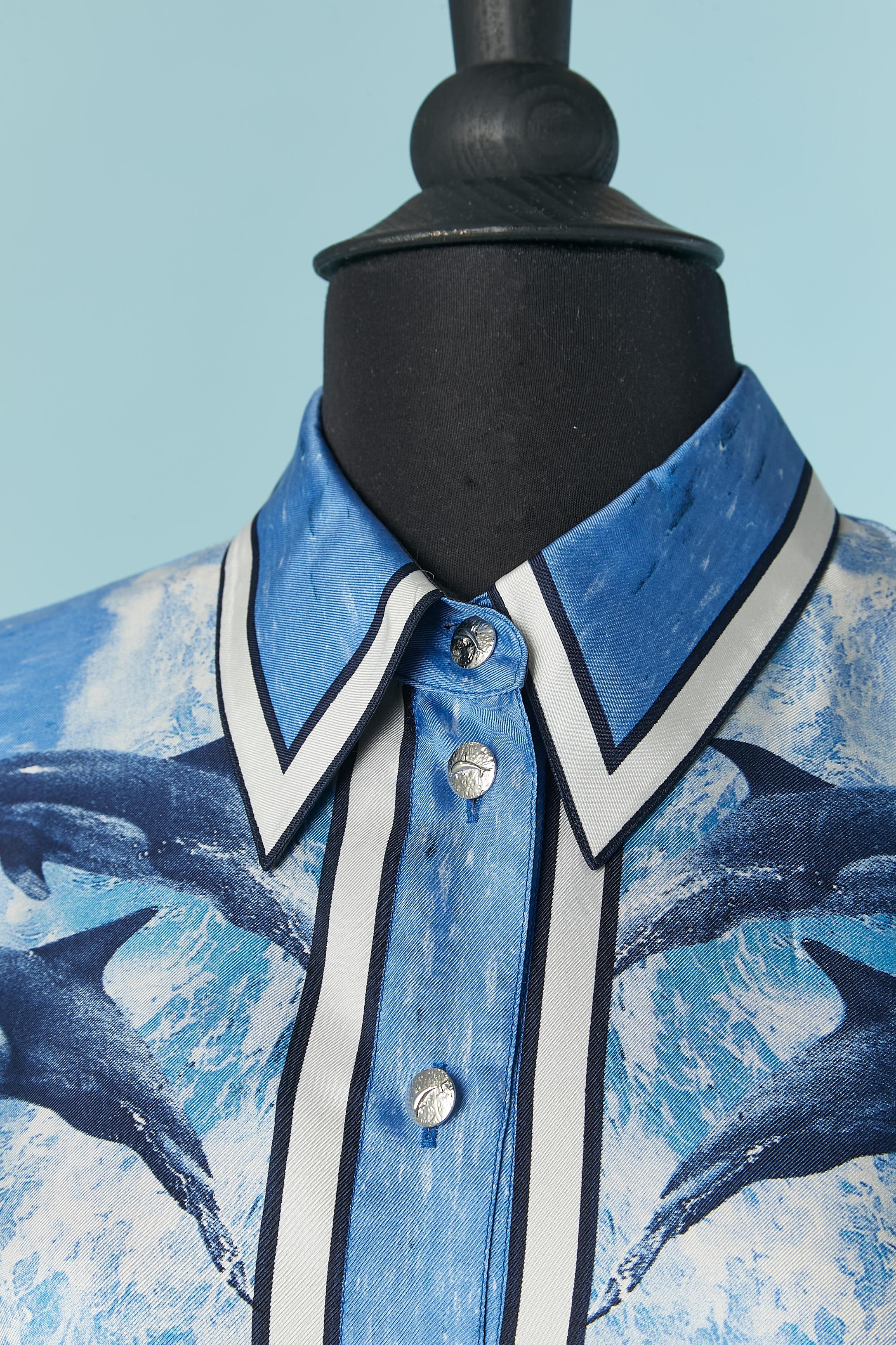 Silk shirt with dolphin print and dolphin buttons on the middle front and cuffs. 
Extra thin shoulder pads.
SIZE 38 but fit M and L 