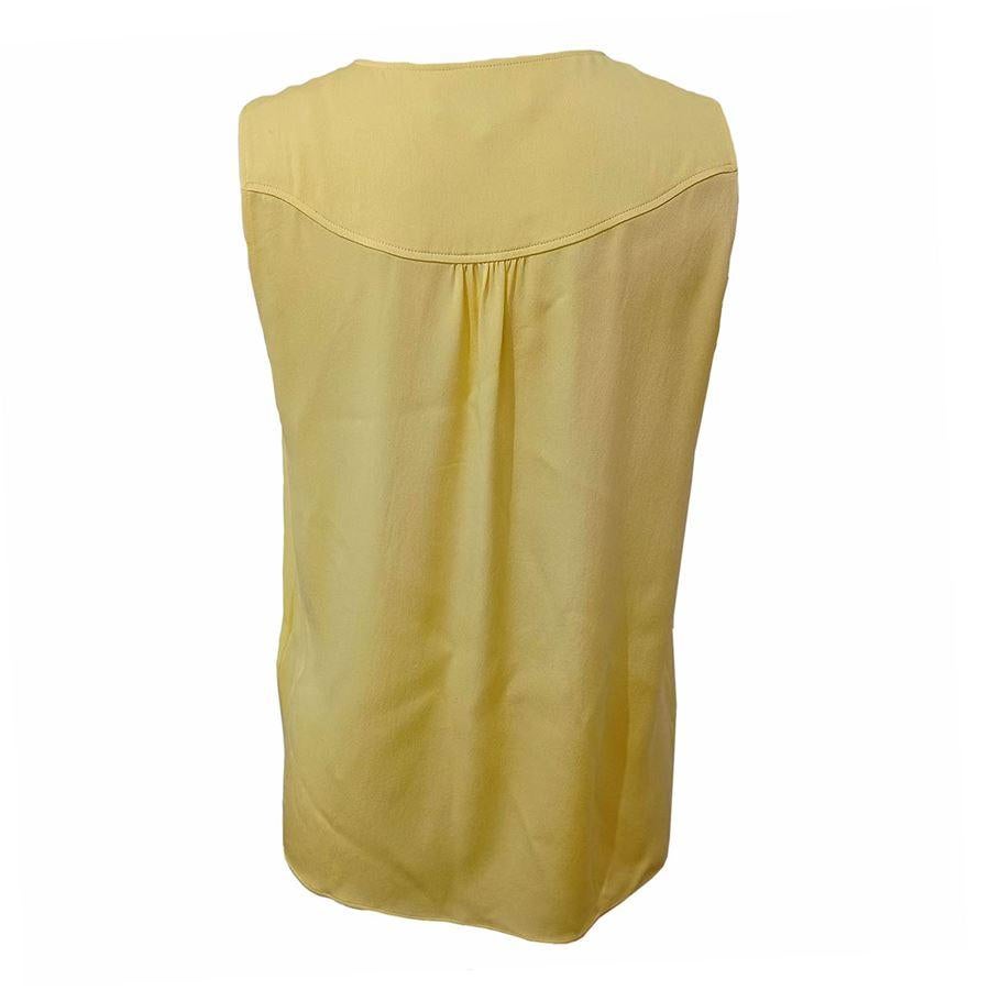 Silk Yellow color Golden button Length shoulder/hem cm 55 (2165 inches)
