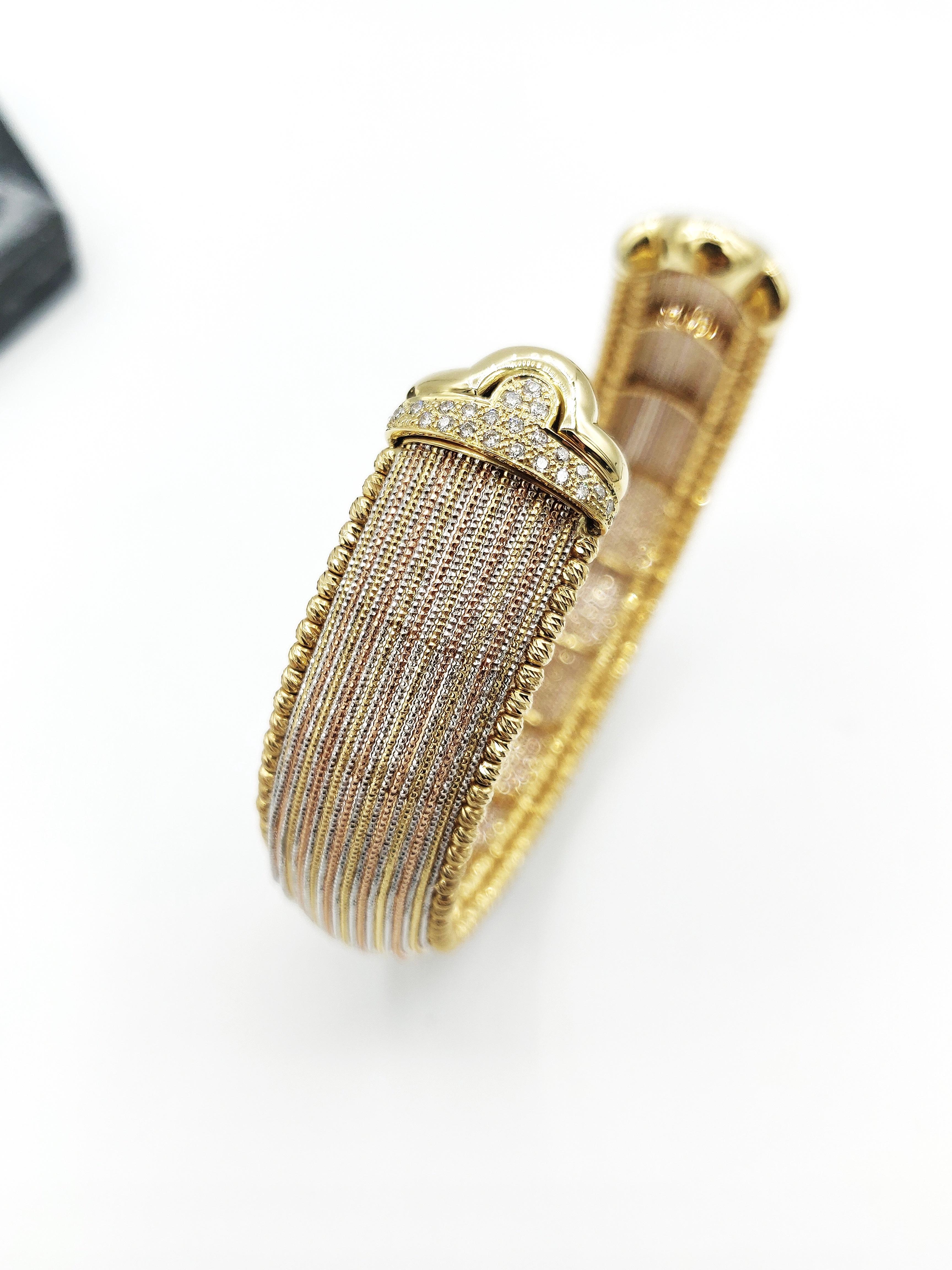Silk Thread Effect Tri-Colour 18 Karat Gold Open Bangle with Diamond End Caps

Gold: 18K 41.263g.
Diamond: 0.35ct.