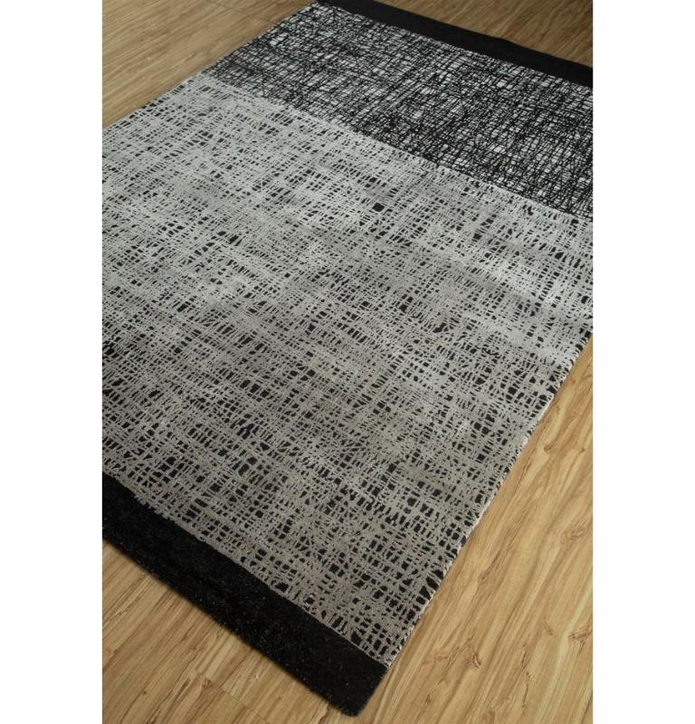 This exquisite handcrafted rug from our Free Verse By Kavi seamlessly blends traditional weaving styles with contemporary allure, presenting a visual feast for your living space. The rug displays a rich caviar gray palette, oozing sleek versatility.