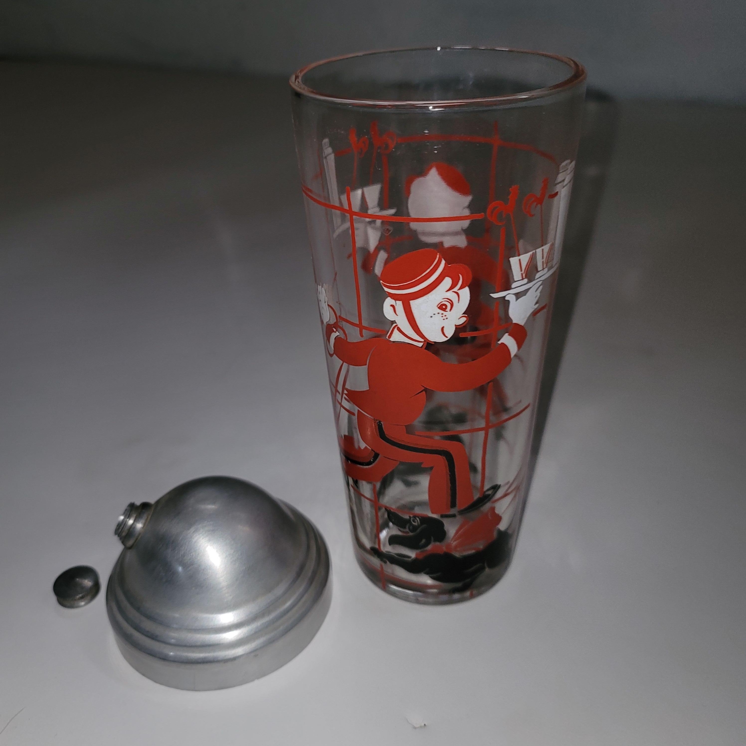 Silkscreen bellhop with dachshund in tow delivering cocktails . The set includes the cocktail shaker and the more elusive pitcher. The process is silkscreen and was produced in the 1930s. Colors are very vivid. The shaker has an aluminum top.