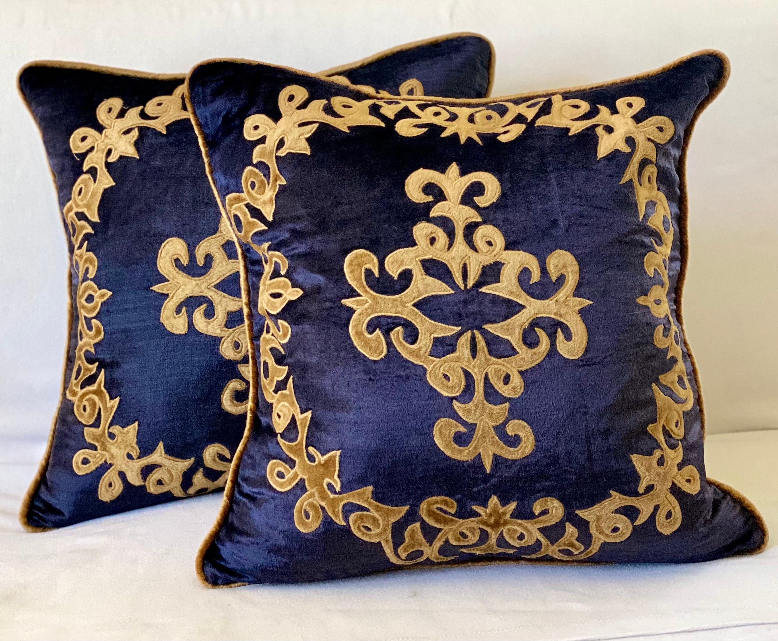 Semi antique silky velvet pillows with wonderful applique designs.
The pillows are filled with down and Feathers, and close with a zipper.

 