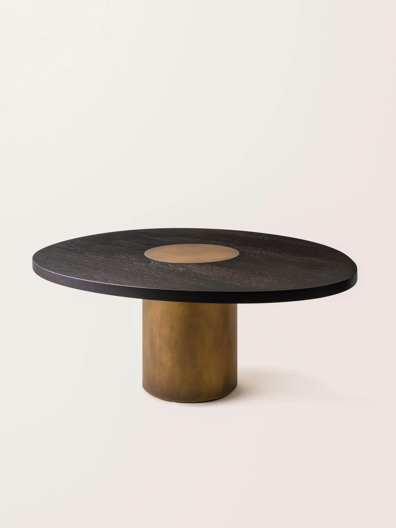 Inspired by the form and function of grain silos, the sculptural Silo Coffee Tables feature solid wood and hand-finished brass or stainless steel wrapped legs. The coffee tables are available in two height options and four sizes to allow for various