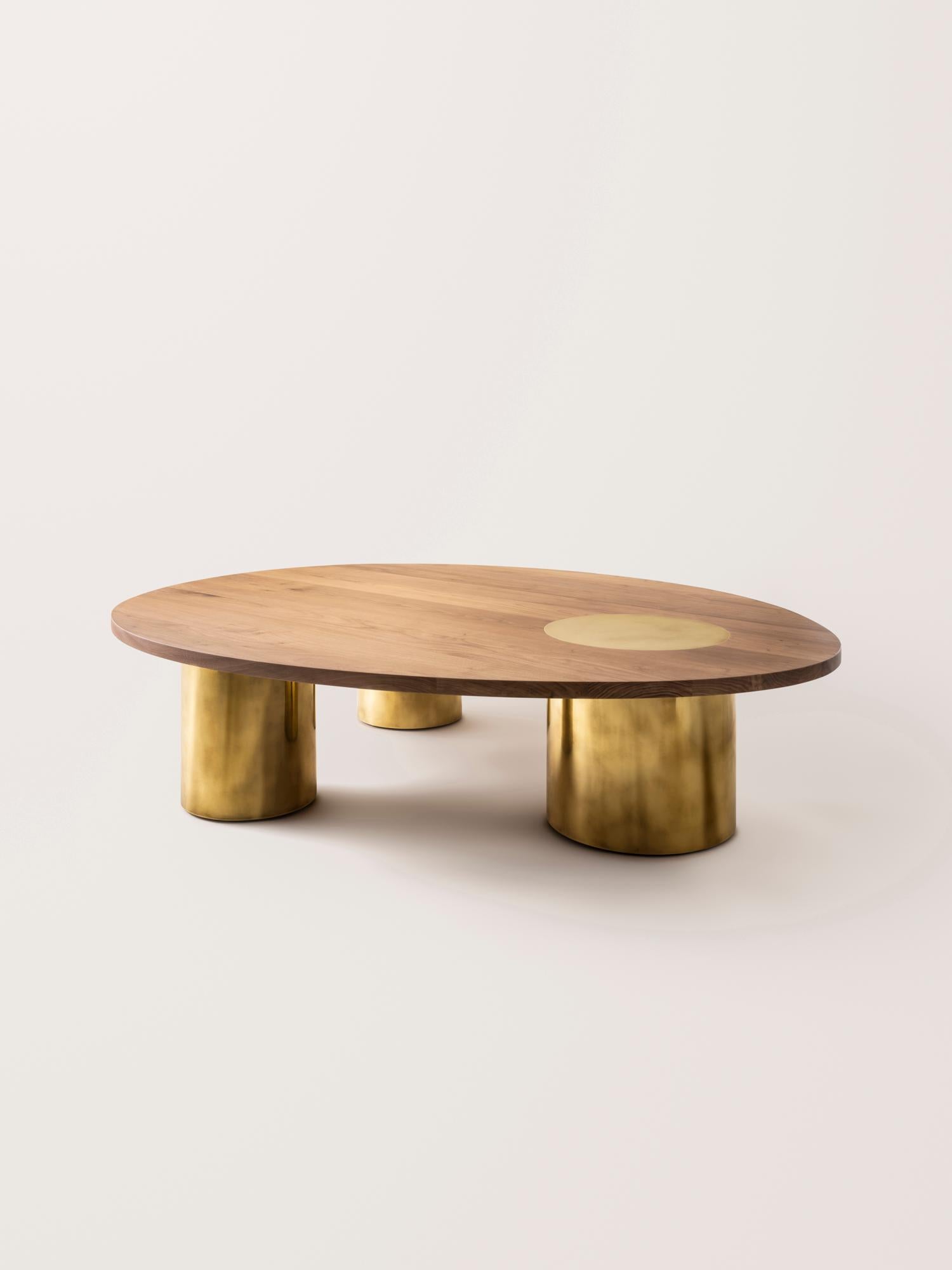 Inspired by the form and function of grain silos, the sculptural Silo Coffee Tables feature solid wood and hand-finished brass or stainless steel wrapped legs. The coffee tables are available in two height options and four sizes to allow for various