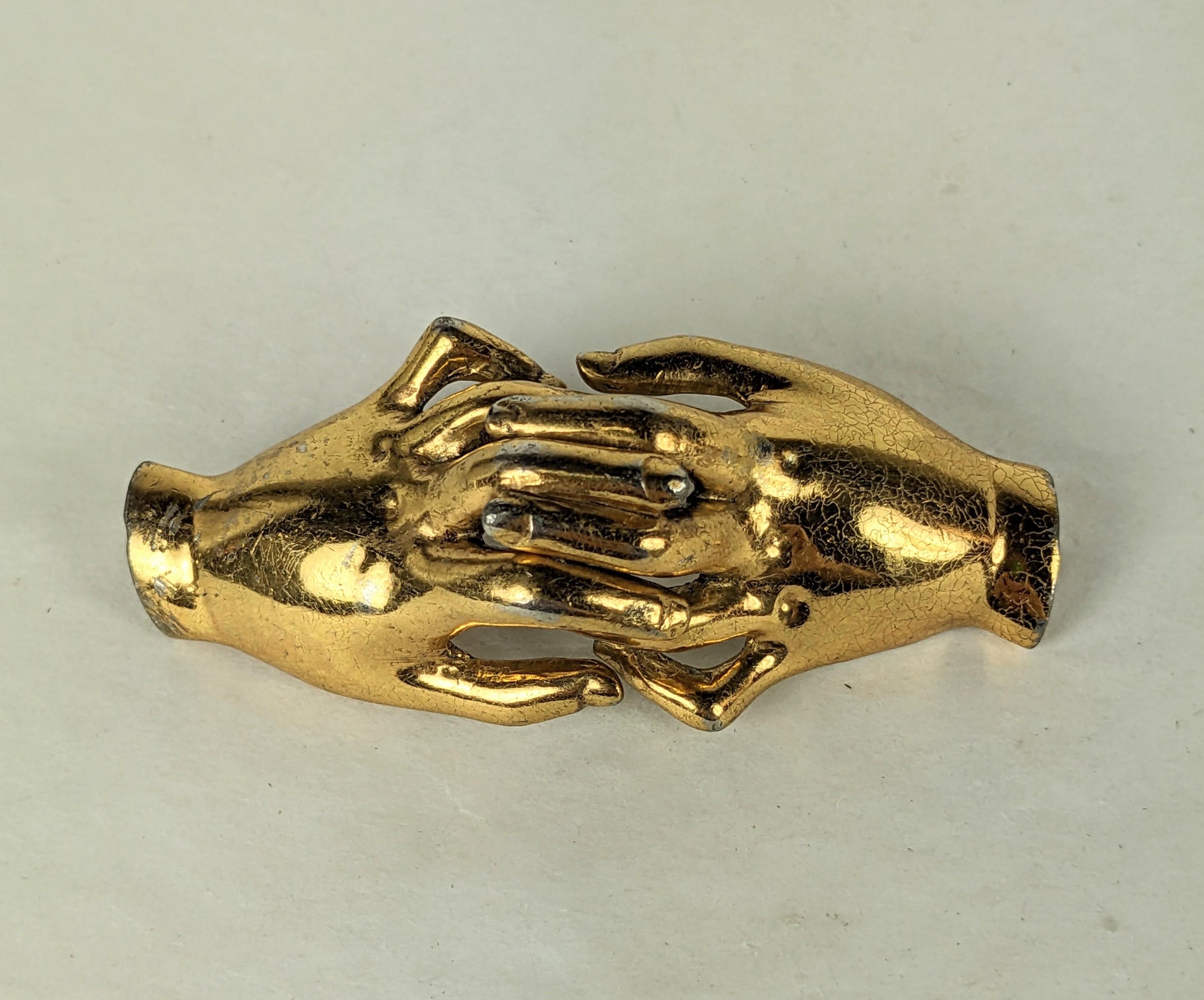 Charming Silson Clutched Hands Retro Corsage Brooch from the 1940's. A pair of realistically modeled gilt hands is designed to be pinned over a corsage or bouquet or fresh flowers for a lapel. Signed. 2.75