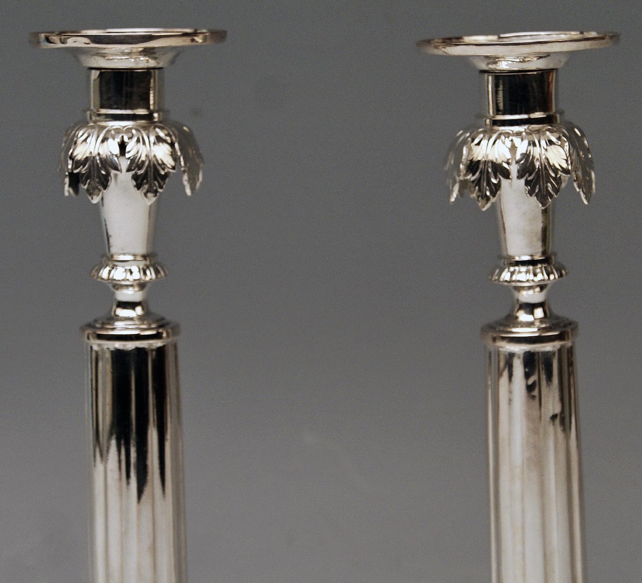 Gorgeous German silver pair of candlesticks of finest manufacturing quality as well as of most elegant appearance:
These candlesticks were made during German Empire period (= circa 1790-1810).
They are stunningly made in following manner: Each of