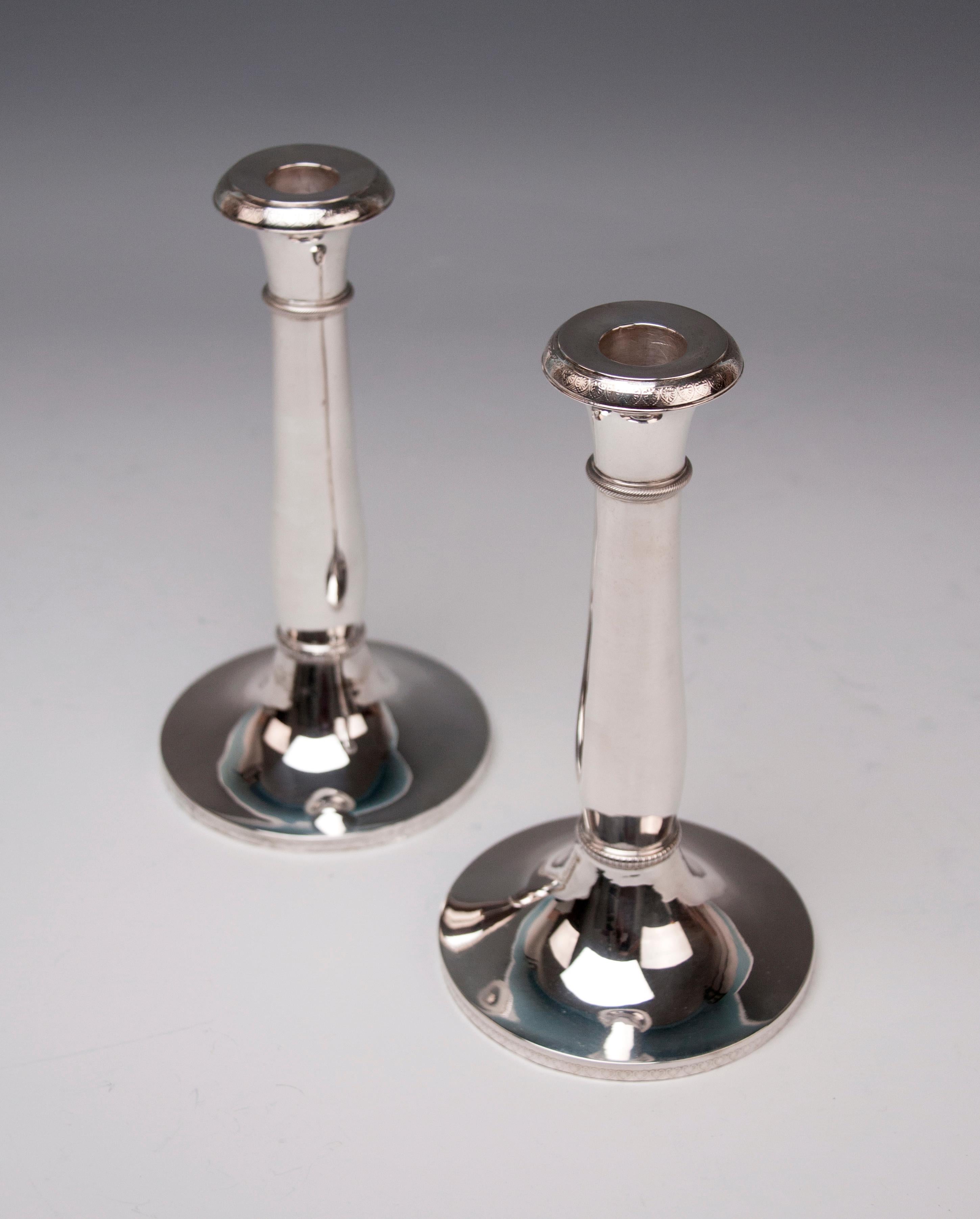 Austrian excellent Biedermeier silver pair of candlesticks, made circa 1830.

Very interesting Viennese silver pair of candlesticks of finest manufacturing quality as well as of elegant appearance. These candlesticks were made during climax of