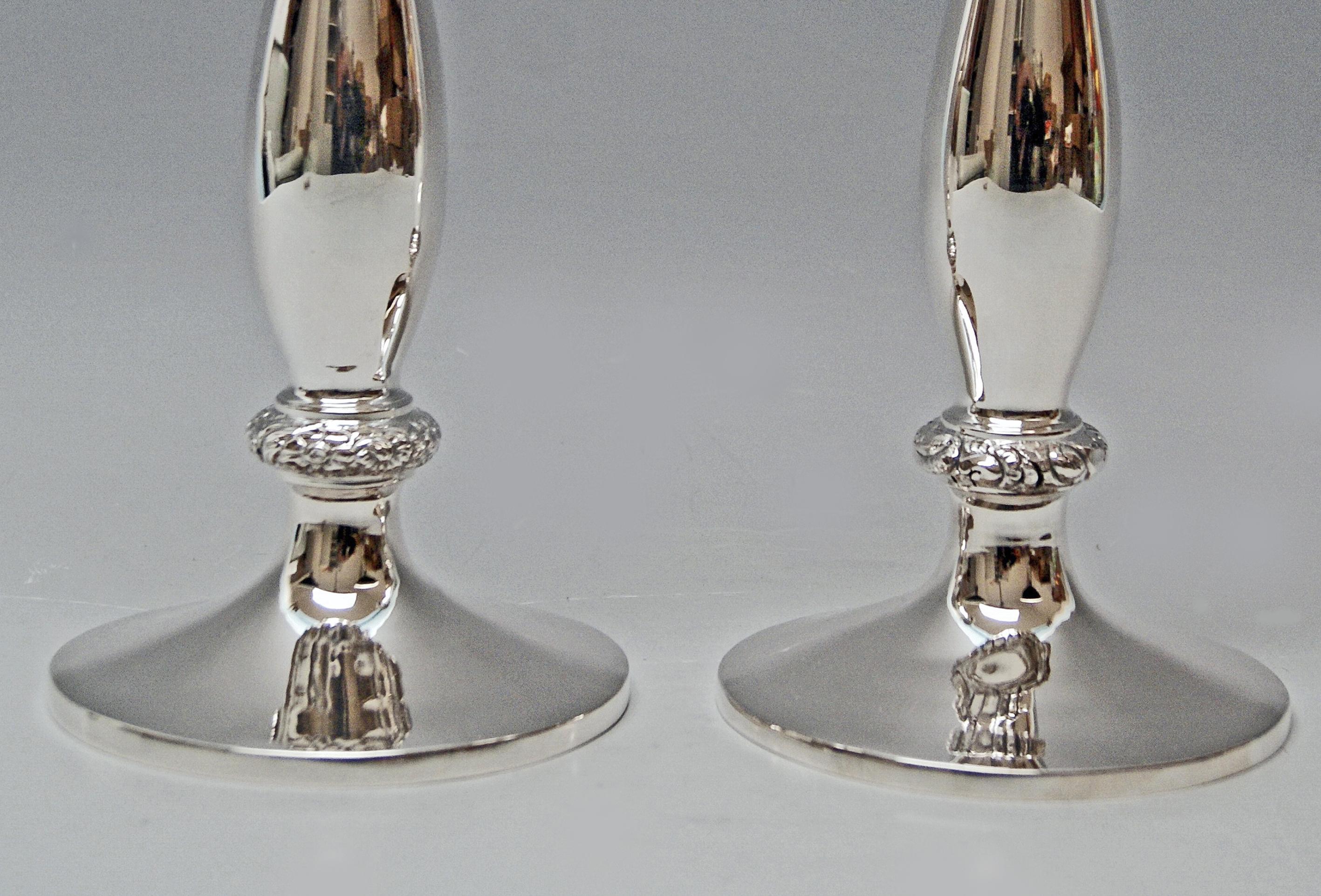 Austrian silver pair of candlesticks of finest manufacturing quality as well as of most elegant appearance:
These candlesticks with smooth surface were made during Viennese Biedermeier period which had been as from circa 1815 until 1850. The