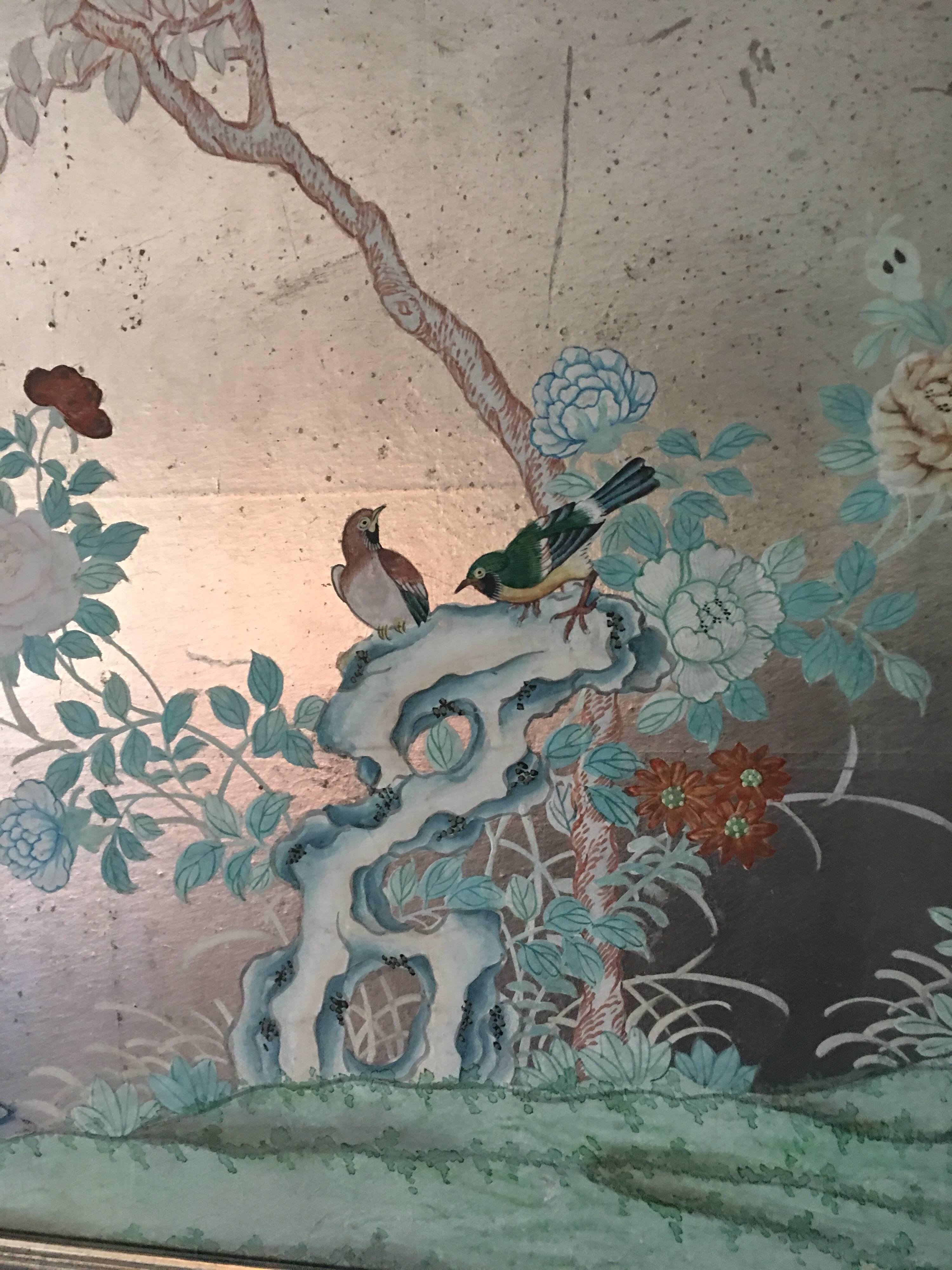 1930s silver chinoiserie wallpaper remnant will hand-painted scene of birds and trees. Newly custom framed in silver leaf frame with low glare glass.