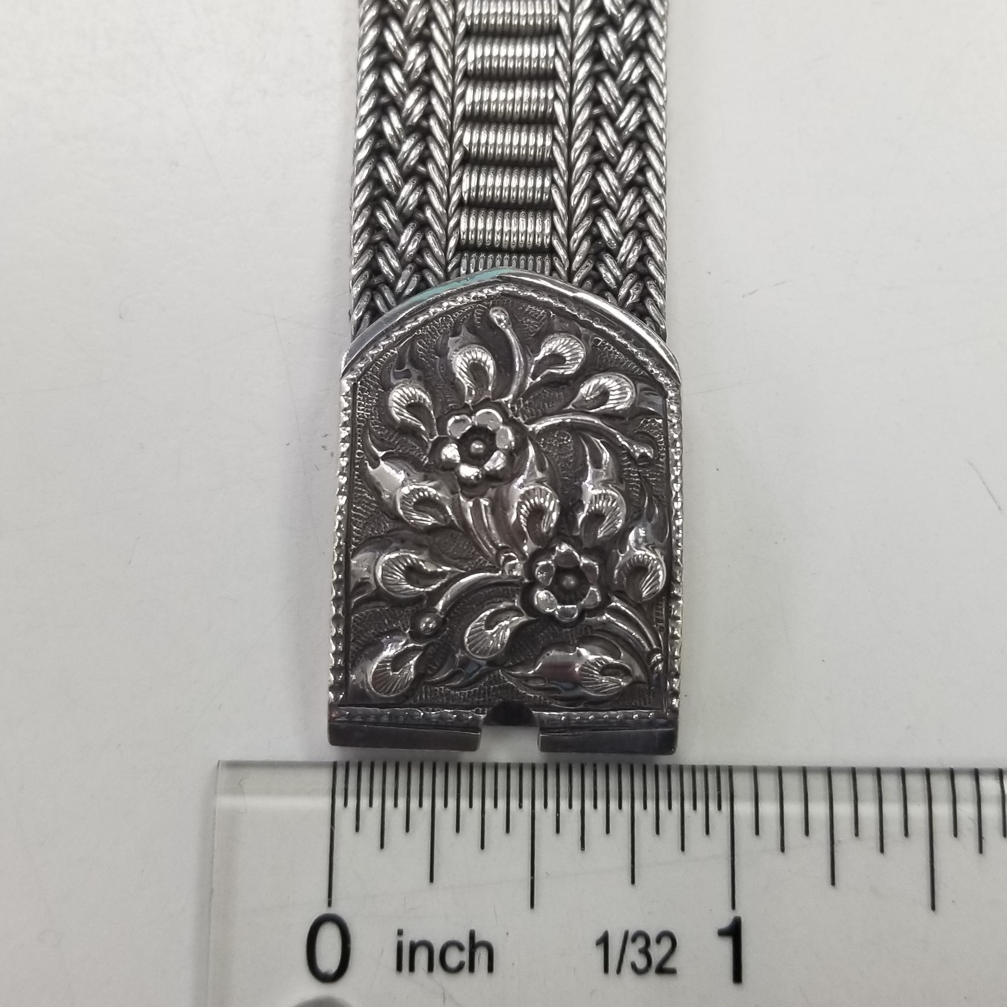 Contemporary Silver 3 row mesh bracelet with flower motif center and on clasp