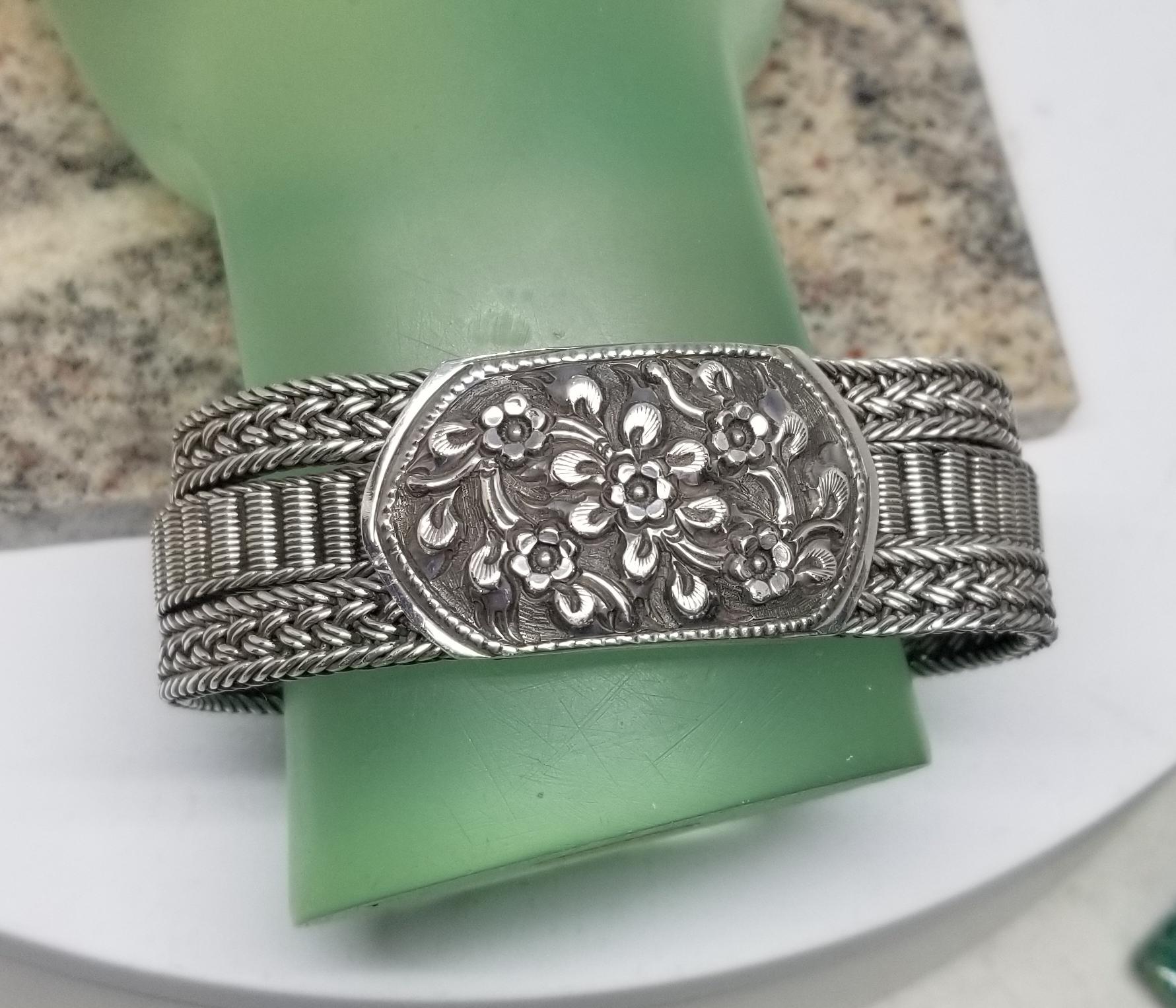 Silver 3 row mesh bracelet with flower motif center and on clasp 1
