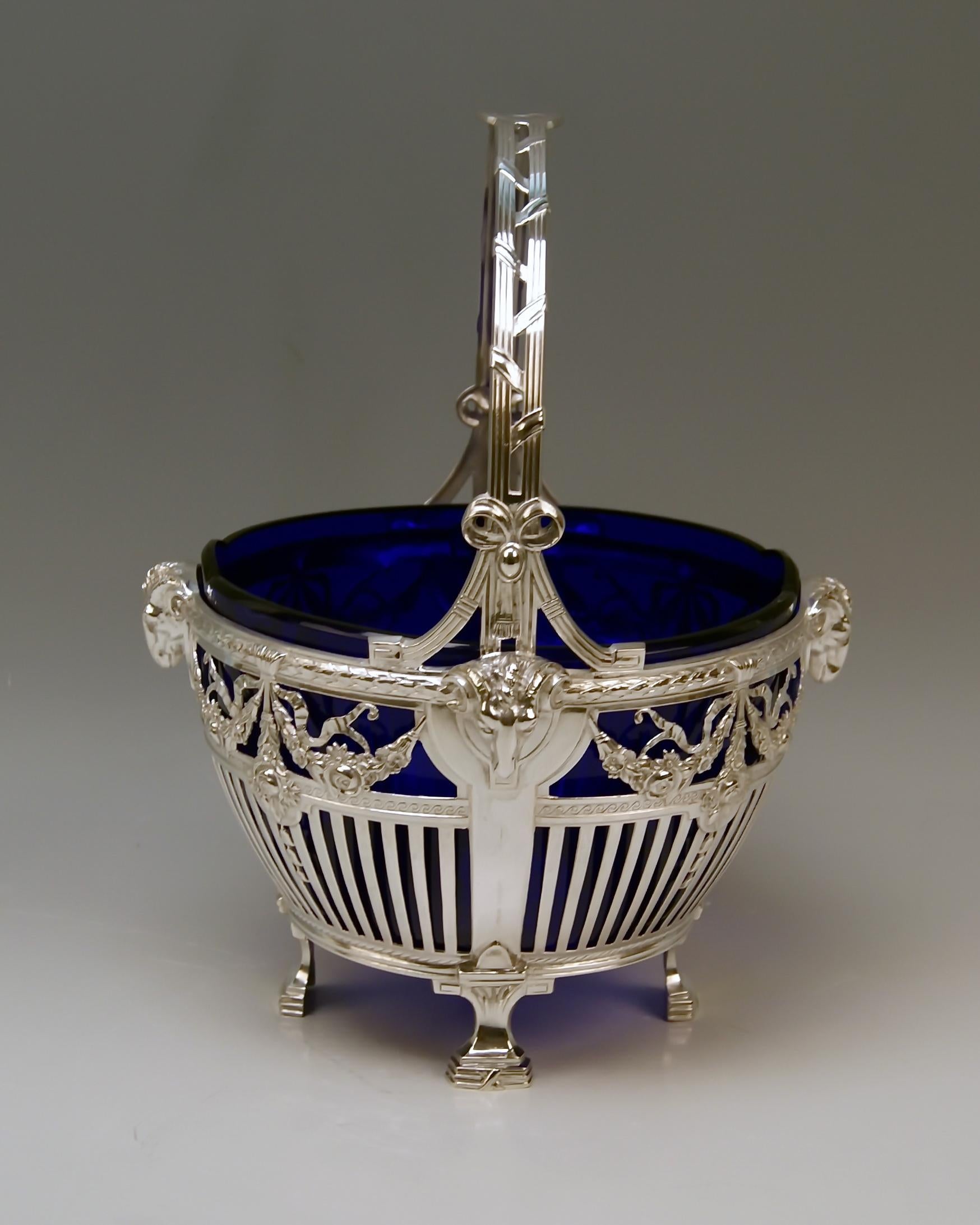 Gorgeous Art Nouveau Silver 800 basket with handle and original cobalt blue glass liner.

Made in Germany/ Bremer Silberwarenfabrik, circa 1905-1910
As from year 1905 Bremer Silberwaren-Fabrik used the figural 