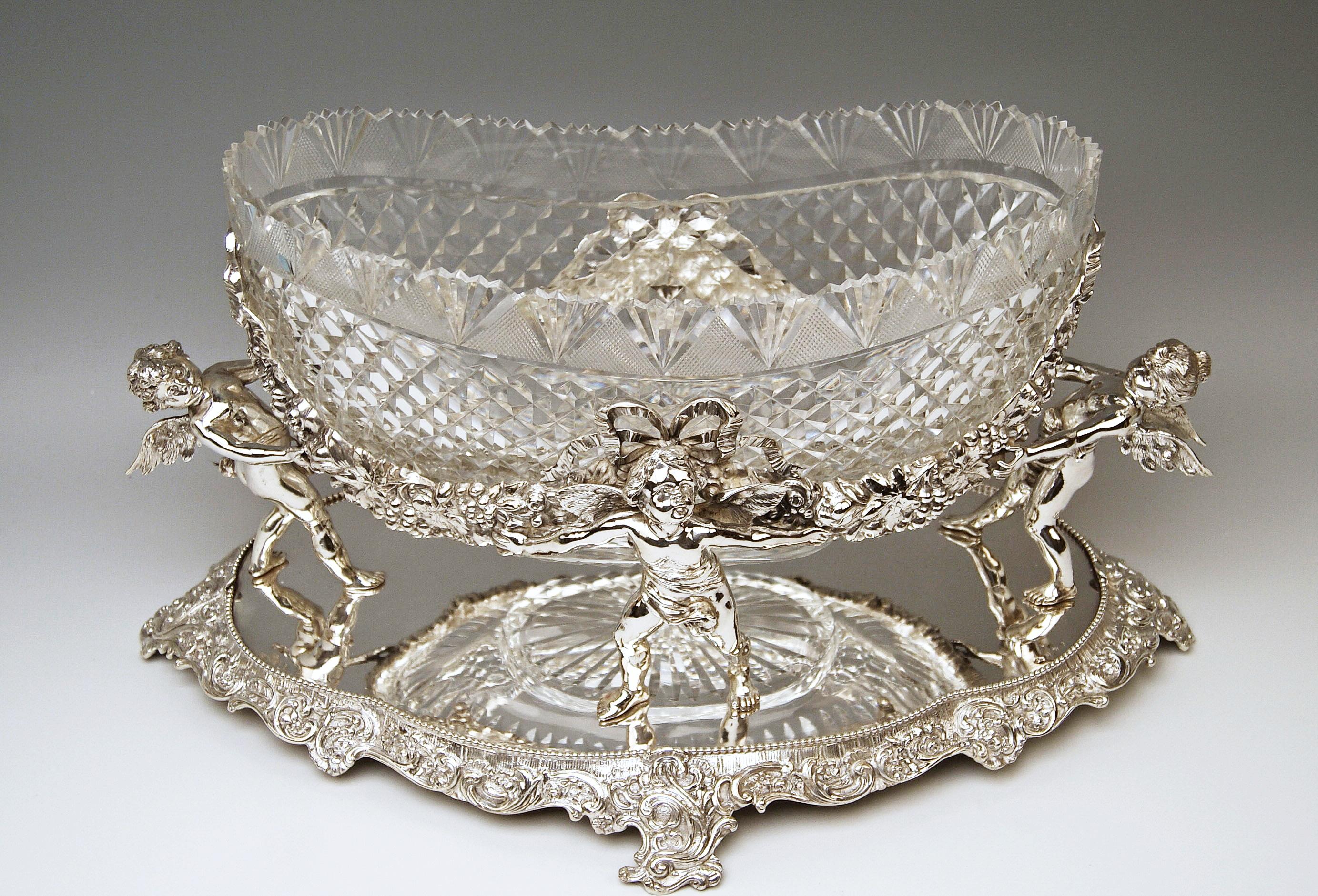 Silver German huge flower bowl / centrepiece with original gorgeous glass liner
Measures: c (18.30 inches) 

Style of Historicism / Neo-Baroque (made circa 1888-1890)

Silver 800
branded by German Crescent with crown (used as from the year 1888 as
