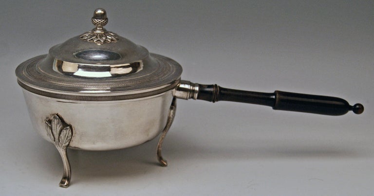 Silver 812.5 (= Silver 13 Lot) Biedermeier lidded casserole with wooden stick
Vienna / Austria, made 1827

Austrian finest silver item of best manufacturing quality !

Specifications:
The casserole is based on three slim feet with leafy