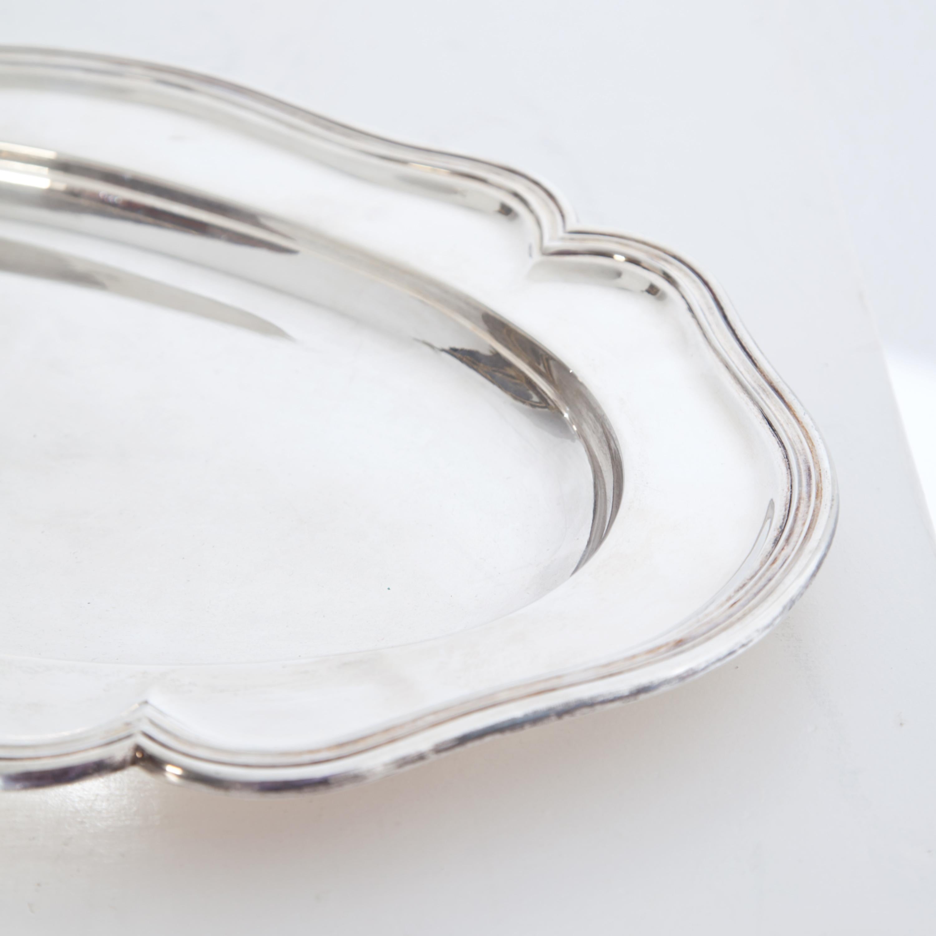 Serving plate stamped with the maker’s mark of F. Hiller in 900 silver. 1203g.