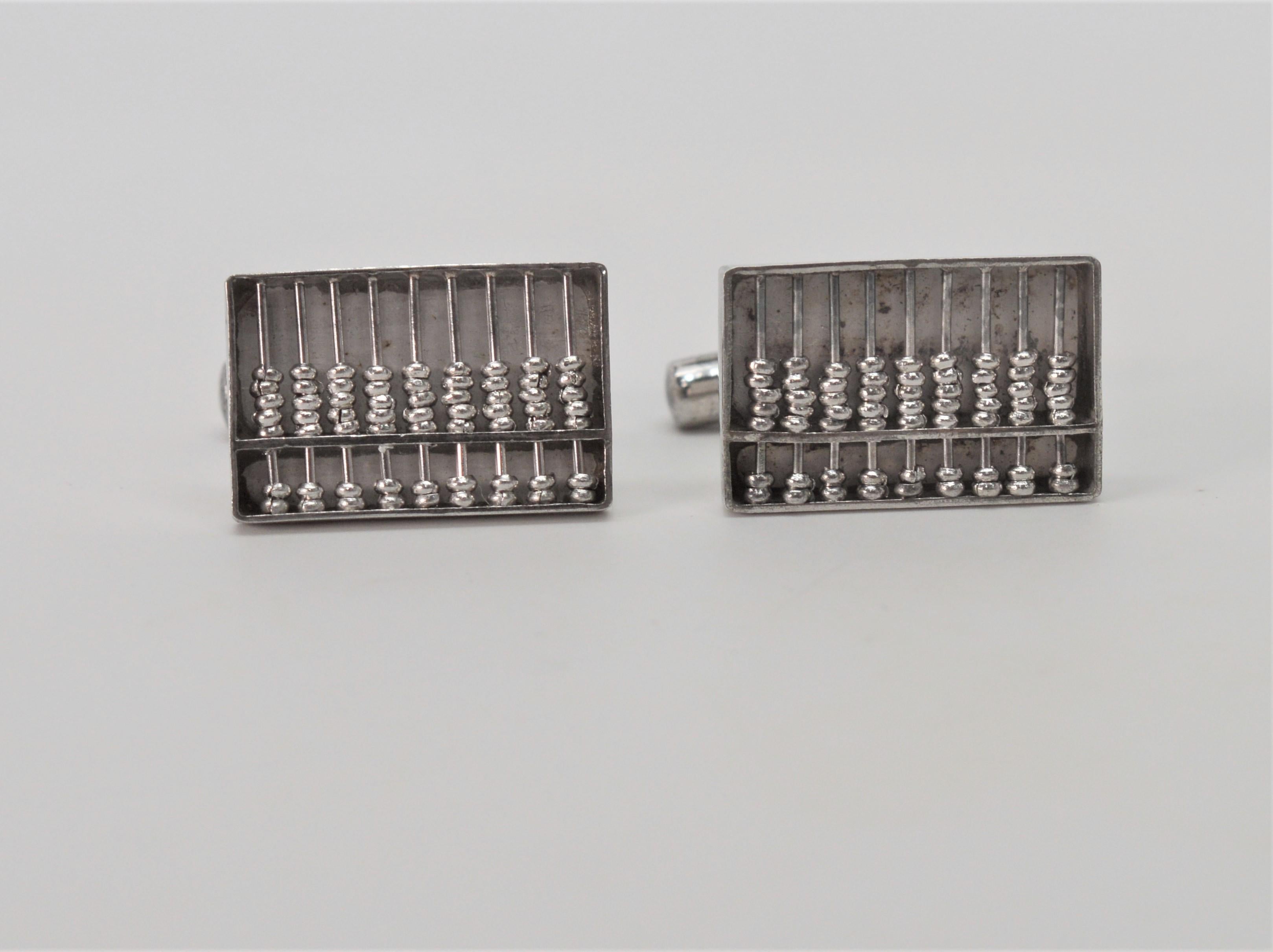  Abacus Cuff Links that function!  This eclectic pair of unisex cuff links measure 20 x 13mm and are made of .800 silver, marked Hong Kong. 
A fun and whimsical gift for the mathematician in your life. Date of manufacture is unknown. From the Estate